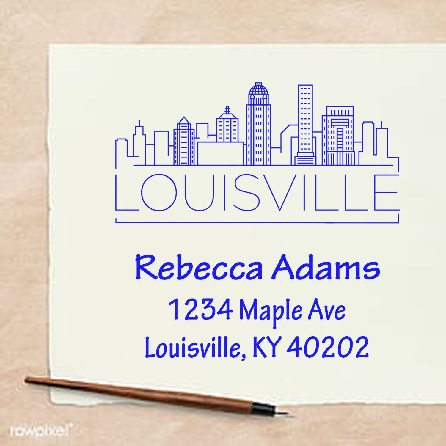 Custom Louisville address rubber stamp with skyline design, personalized for Rebecca Adams, 1234 Maple Ave, Louisville, KY 40202.