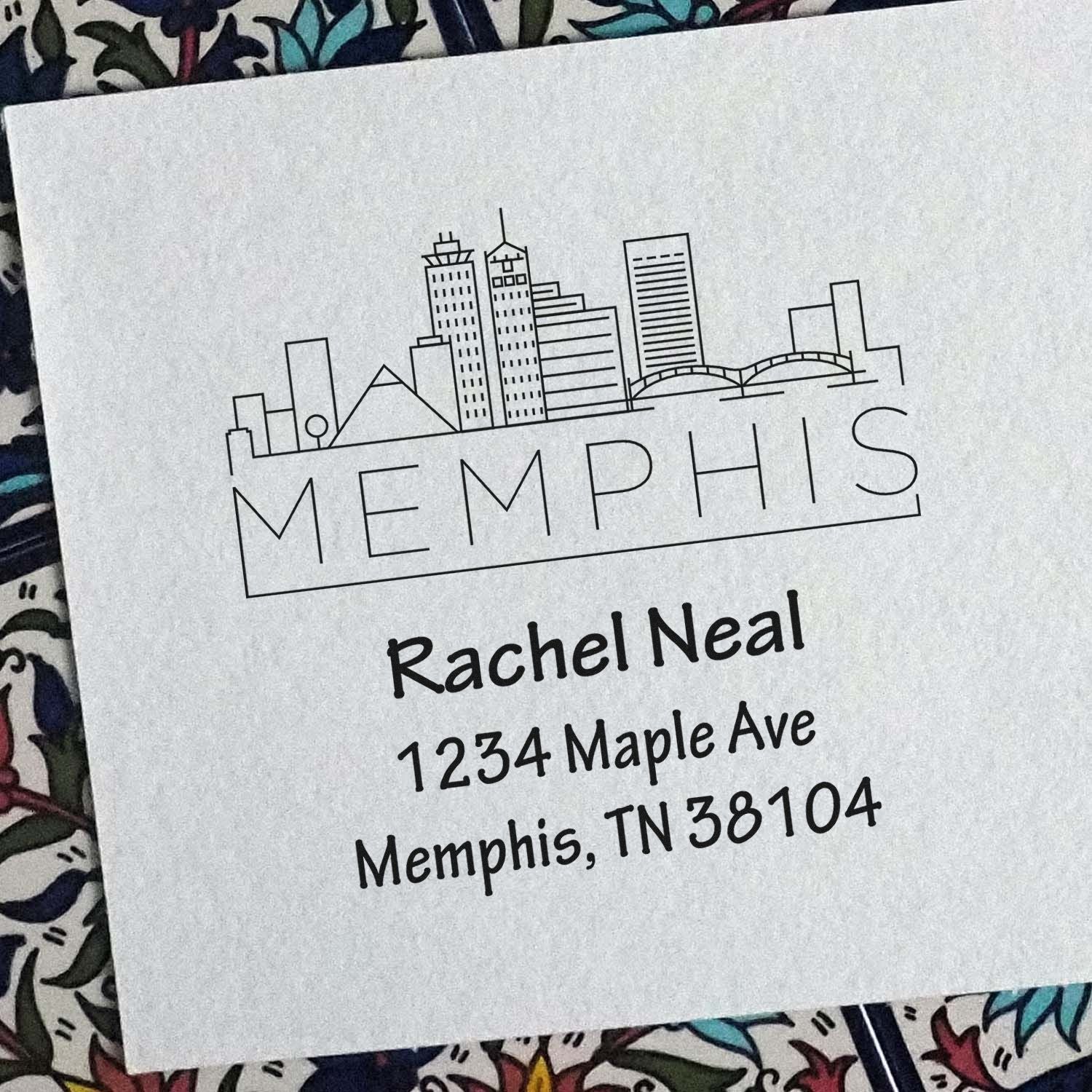 Custom Memphis address rubber stamp with skyline design, personalized for Rachel Neal, 1234 Maple Ave, Memphis, TN 38104.