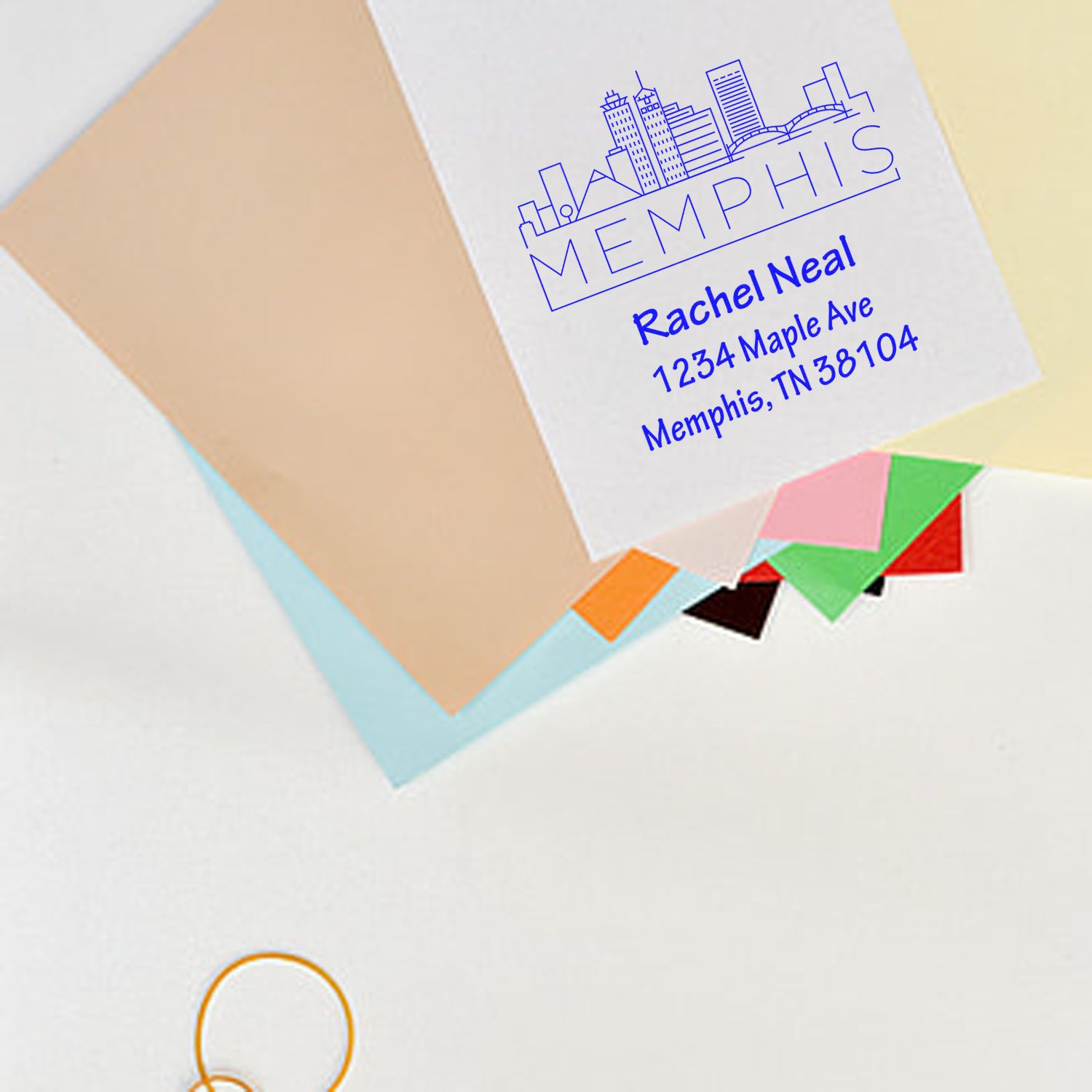 Personalized return address rubber stamp with Memphis skyline logo for envelopes, featuring custom name and address.
