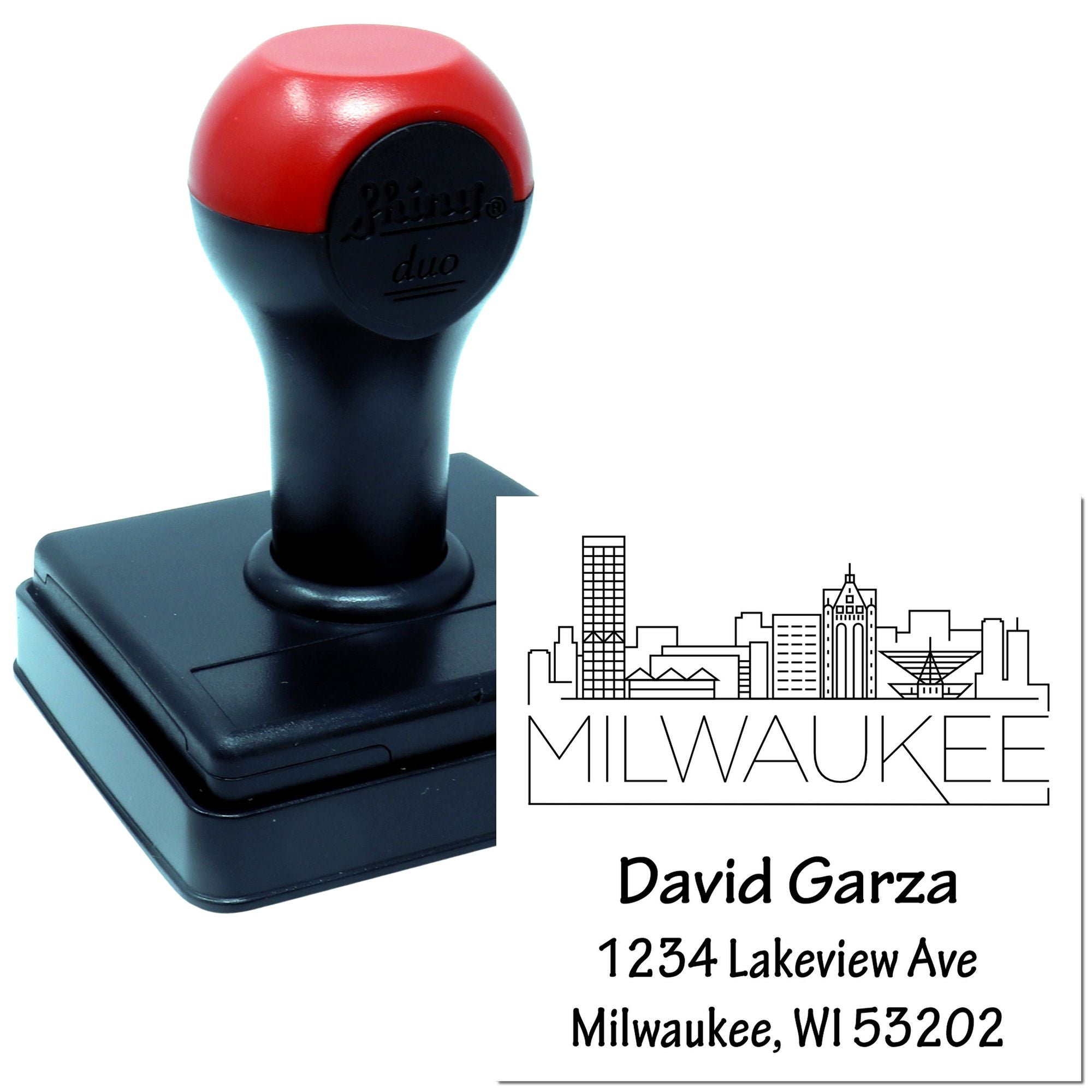 Custom self-inking Milwaukee return address rubber stamp with skyline, David Garza name, and address details.