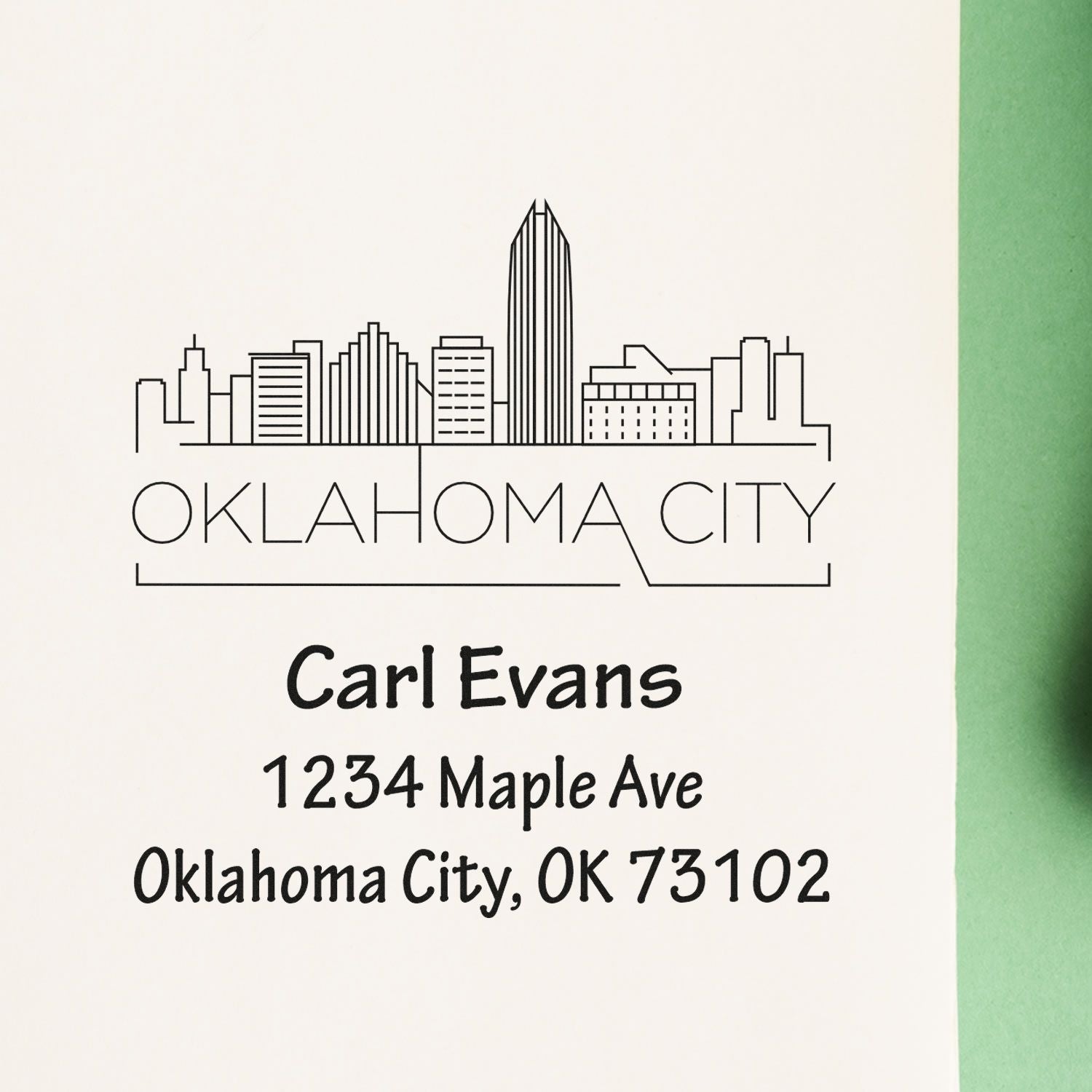 Custom Oklahoma City address rubber stamp with skyline design for Carl Evans, 1234 Maple Ave, OK 73102.