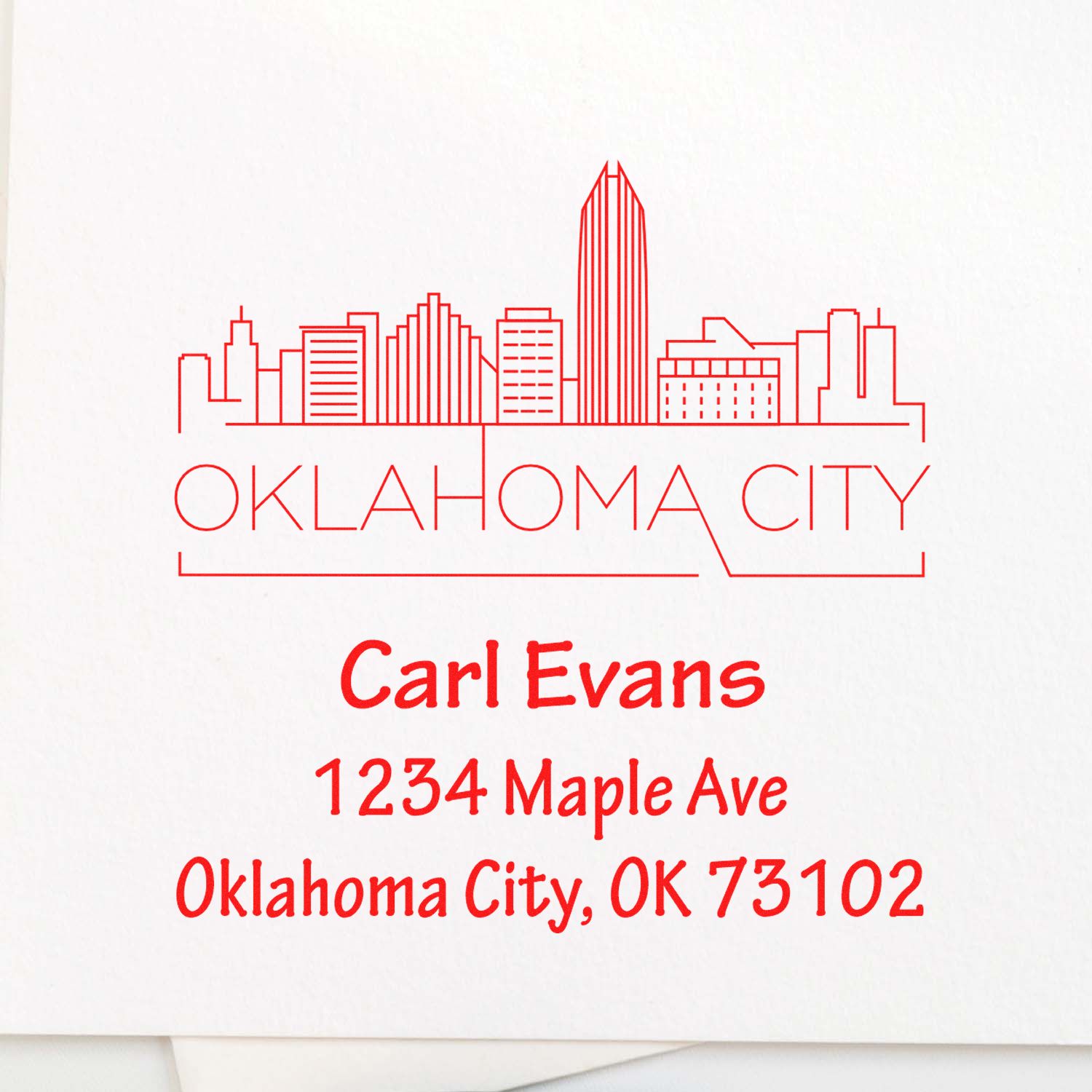 Oklahoma City skyline return address rubber stamp for Carl Evans, 1234 Maple Ave, Oklahoma City, OK 73102.