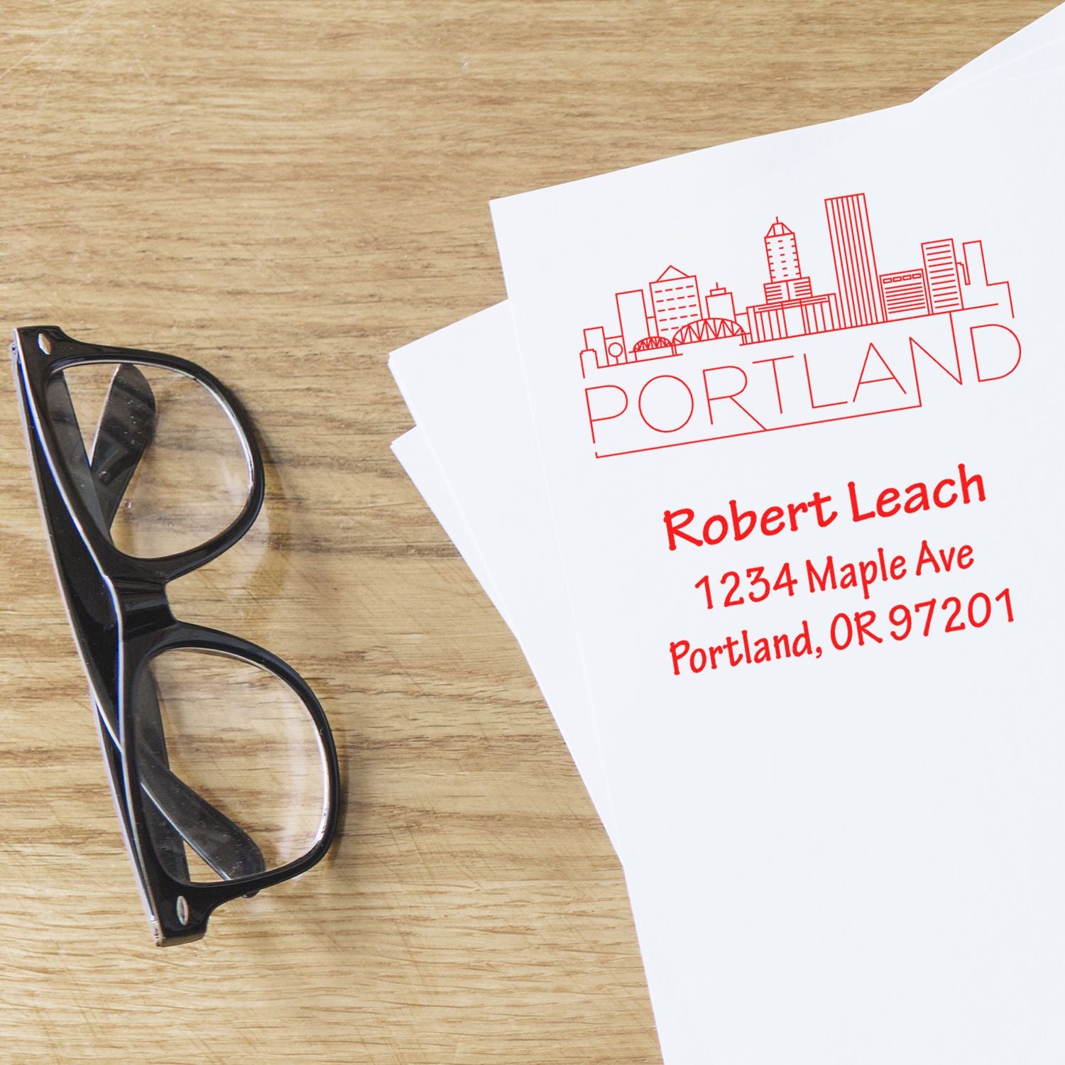 Custom Portland return address rubber stamp with skyline design for personalized mailing envelopes.