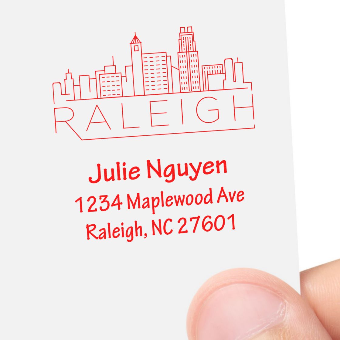 Custom Raleigh skyline address rubber stamp for Julie Nguyen, showing 1234 Maplewood Ave, Raleigh, NC 27601.