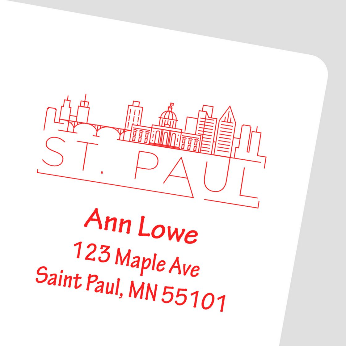 Custom St. Paul return address rubber stamp with skyline design for Ann Lowe, 123 Maple Ave, Saint Paul, MN 55101.