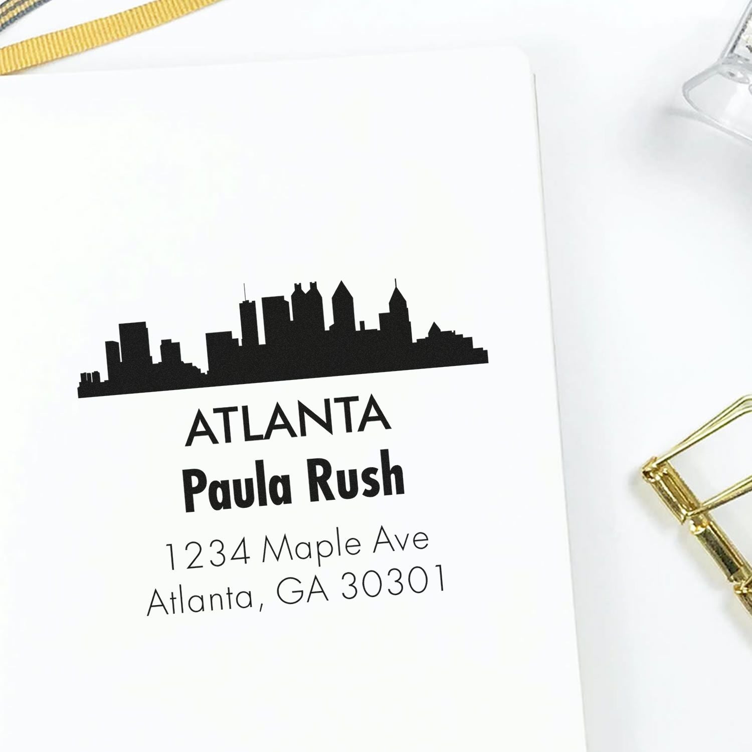 Personalized Atlanta return address rubber stamp with skyline design, name, and mailing address for custom stationery.
