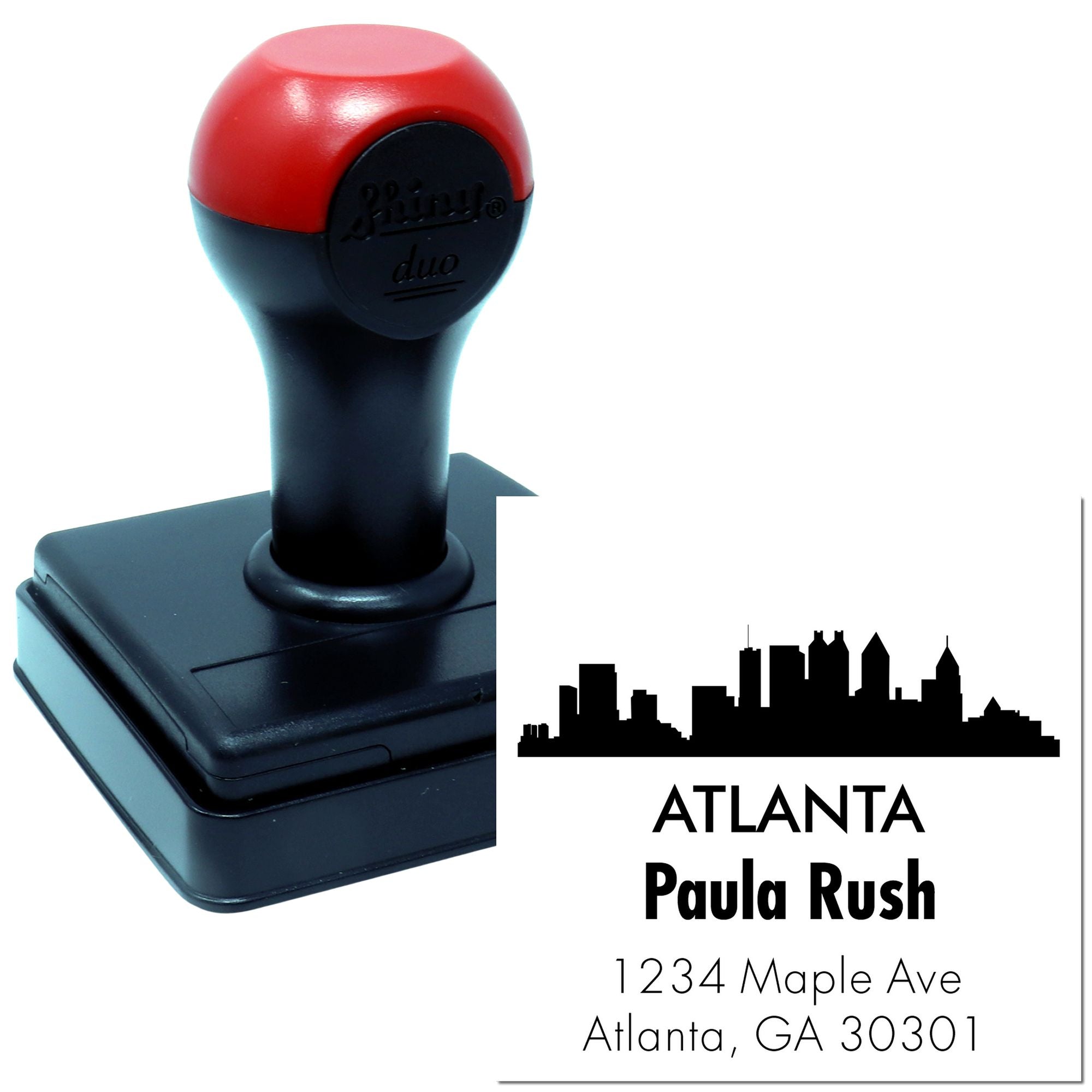 Custom self-inking rubber stamp with Atlanta skyline, Paula Rush name, and address for personalized return address stamping.
