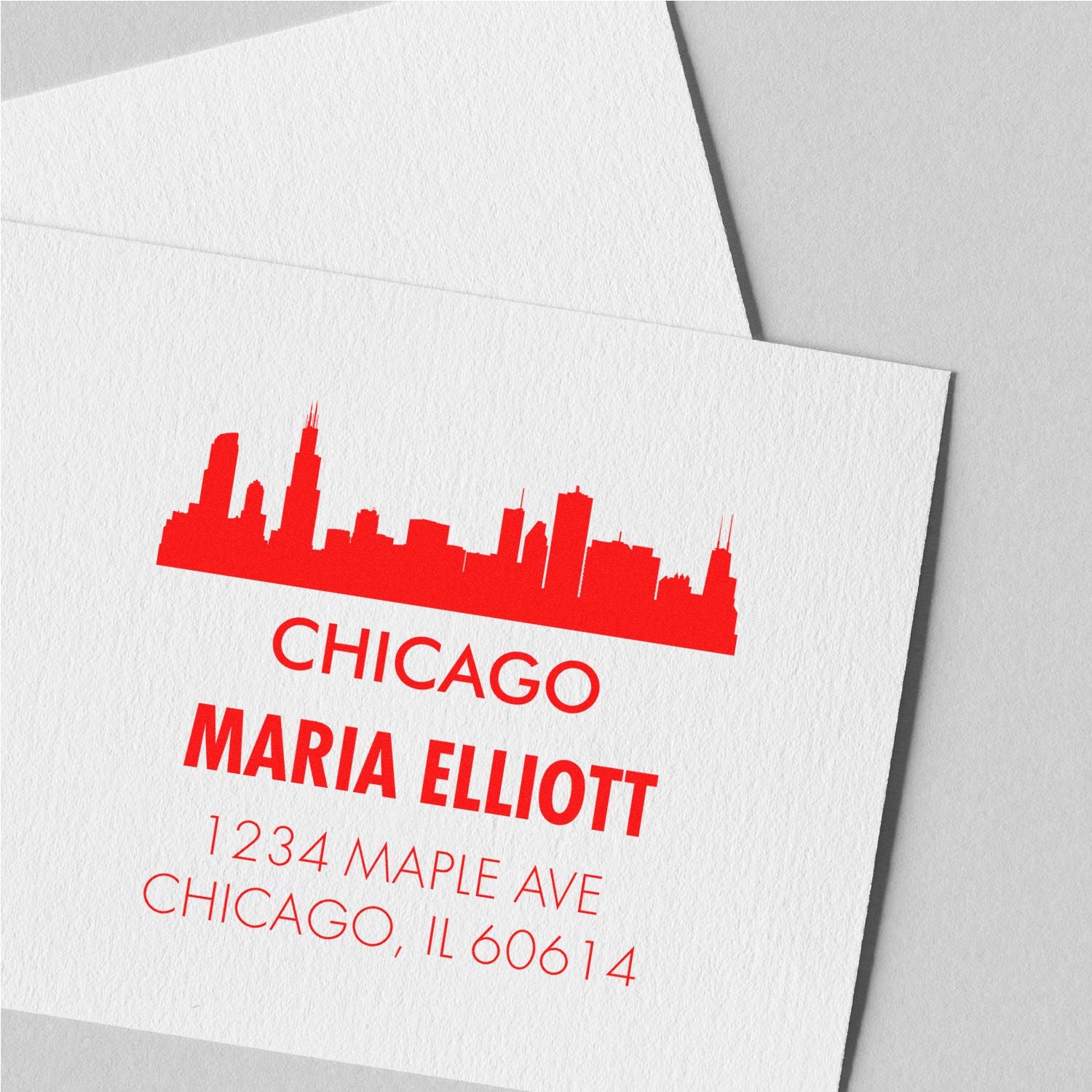Custom Chicago skyline return address rubber stamp for Maria Elliott, 1234 Maple Ave, Chicago, IL 60614.