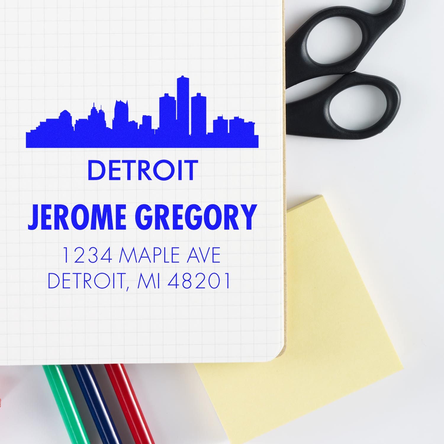 Custom Detroit address rubber stamp with skyline, name, and street address for personalized stationery.