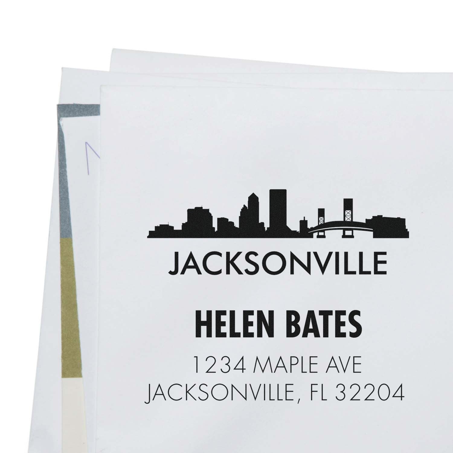 Custom Jacksonville return address rubber stamp with skyline design, Helen Bates name, and personalized mailing address.