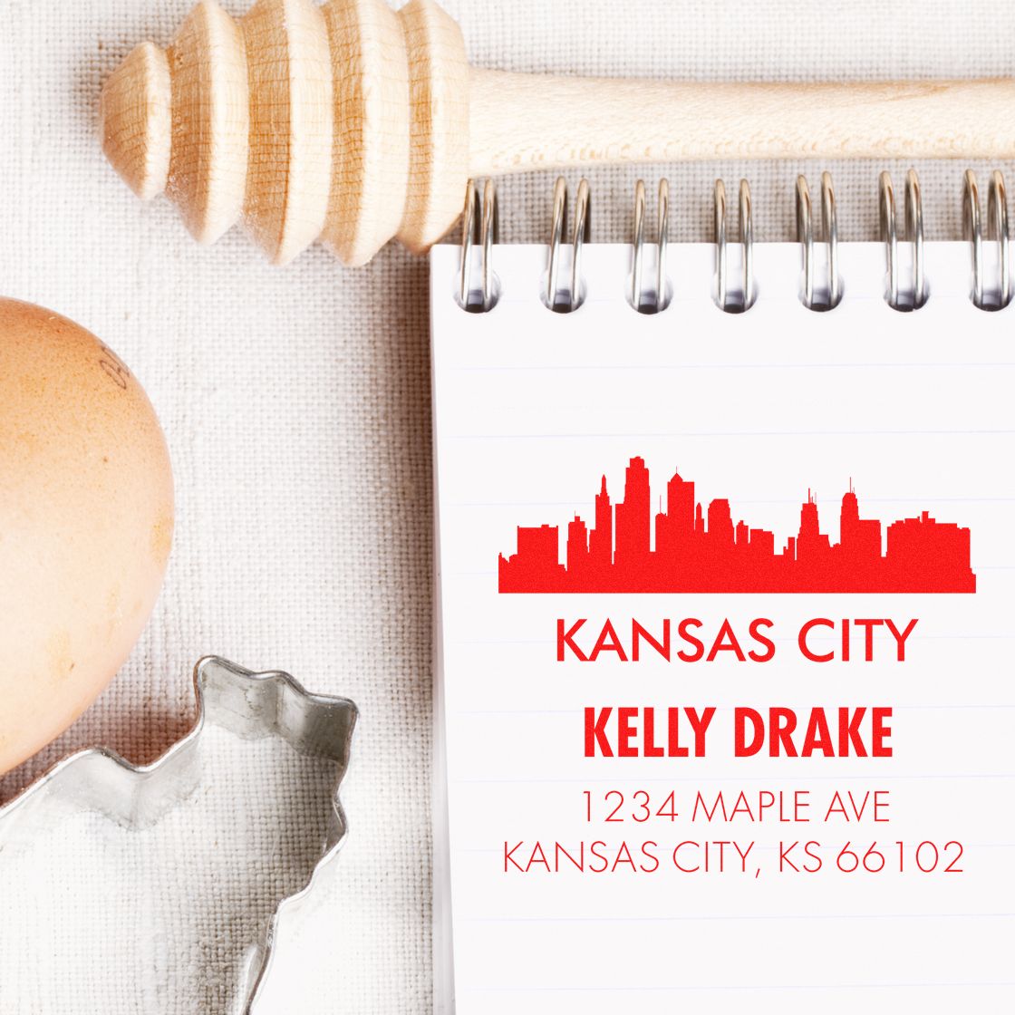 Custom Kansas City return address rubber stamp with skyline logo for Kelly Drake, 1234 Maple Ave, KS 66102.