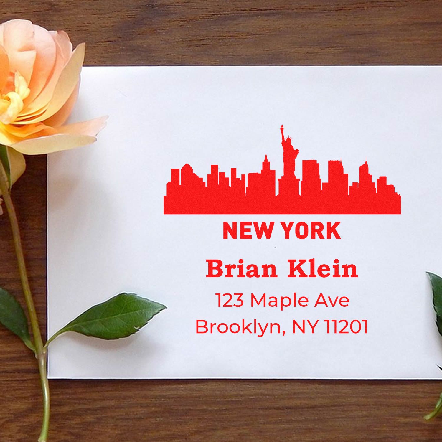 Custom New York skyline rubber stamp with name and Brooklyn return address for personalized mailing.