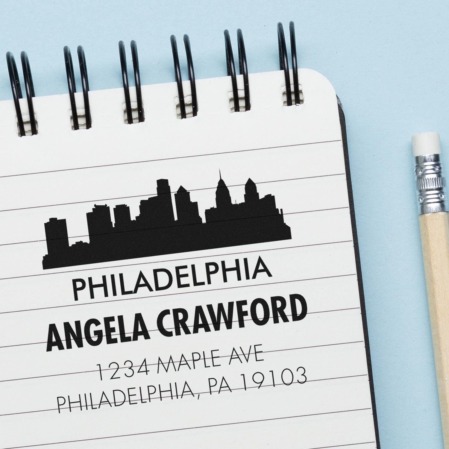 Custom Philadelphia rubber stamp design with skyline, Angela Crawford name, and mailing address.