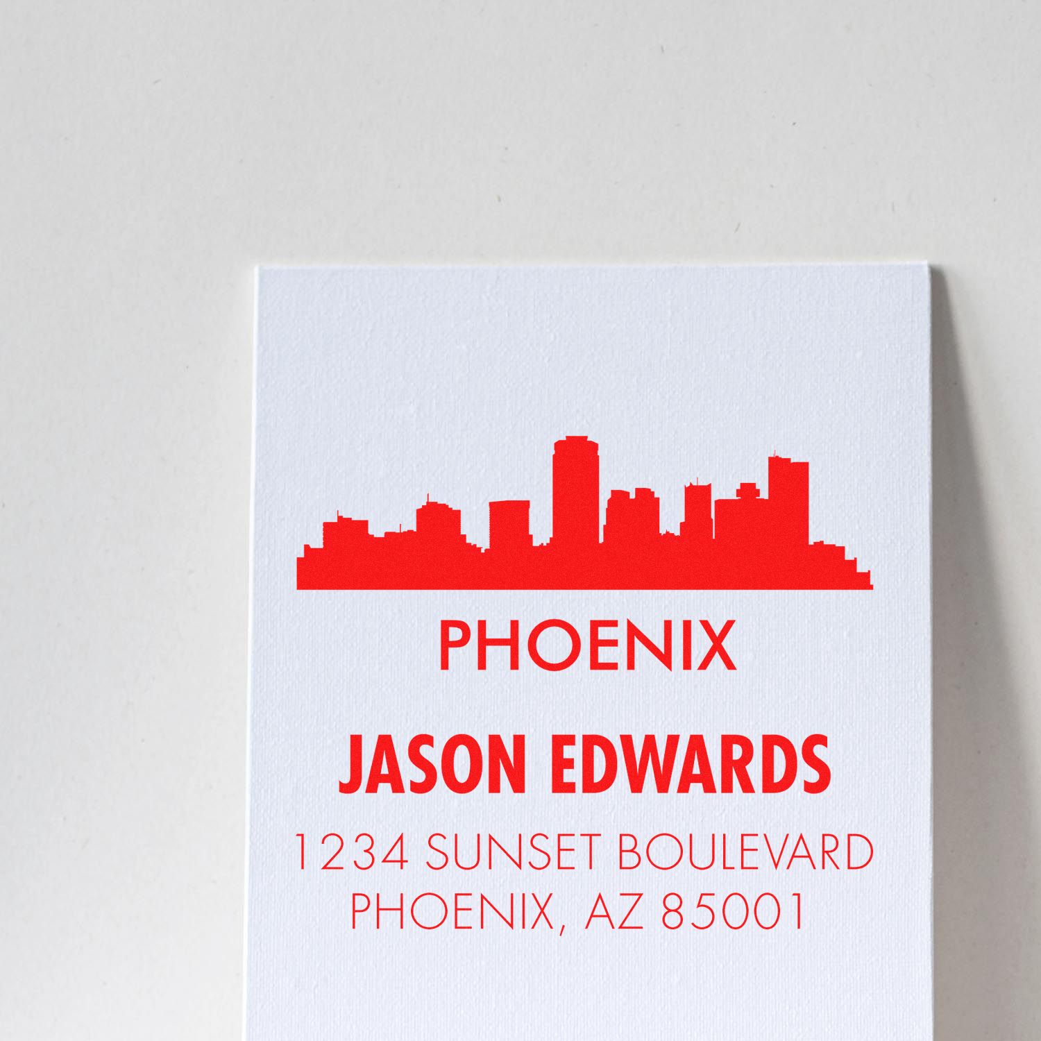 Custom Phoenix address rubber stamp with skyline design for Jason Edwards, 1234 Sunset Boulevard, Phoenix, AZ 85001
