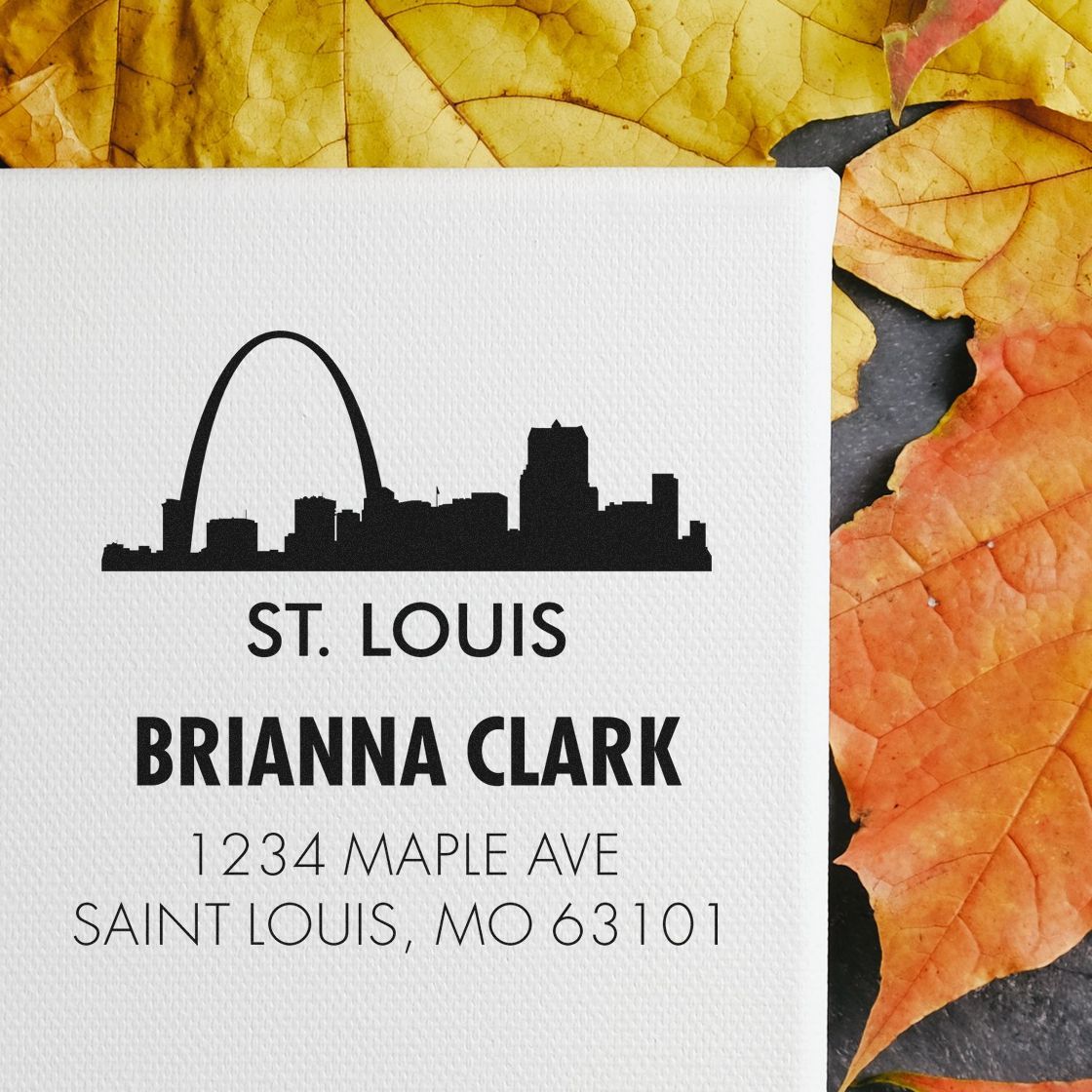 Custom St. Louis return address rubber stamp with skyline design, Brianna Clark name, and mailing address for personalized envelopes.