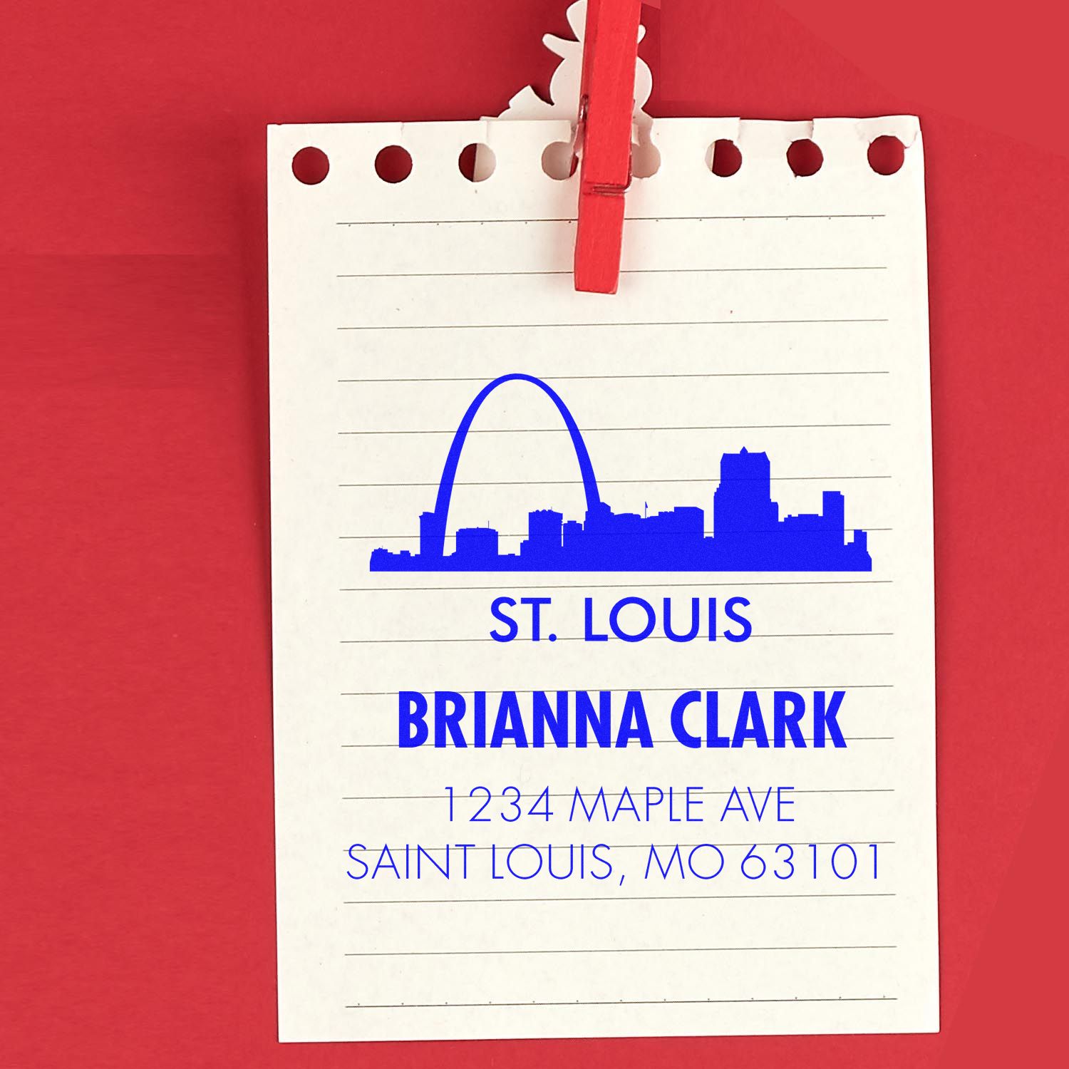 Custom St. Louis address rubber stamp with skyline, Brianna Clark name, and mailing address on lined note paper.