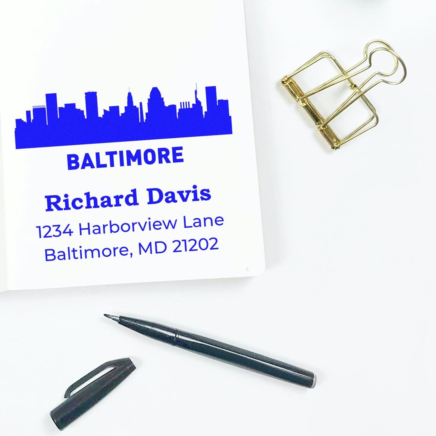 Custom rubber address stamp with Baltimore skyline, Richard Davis name, and Baltimore, MD mailing address