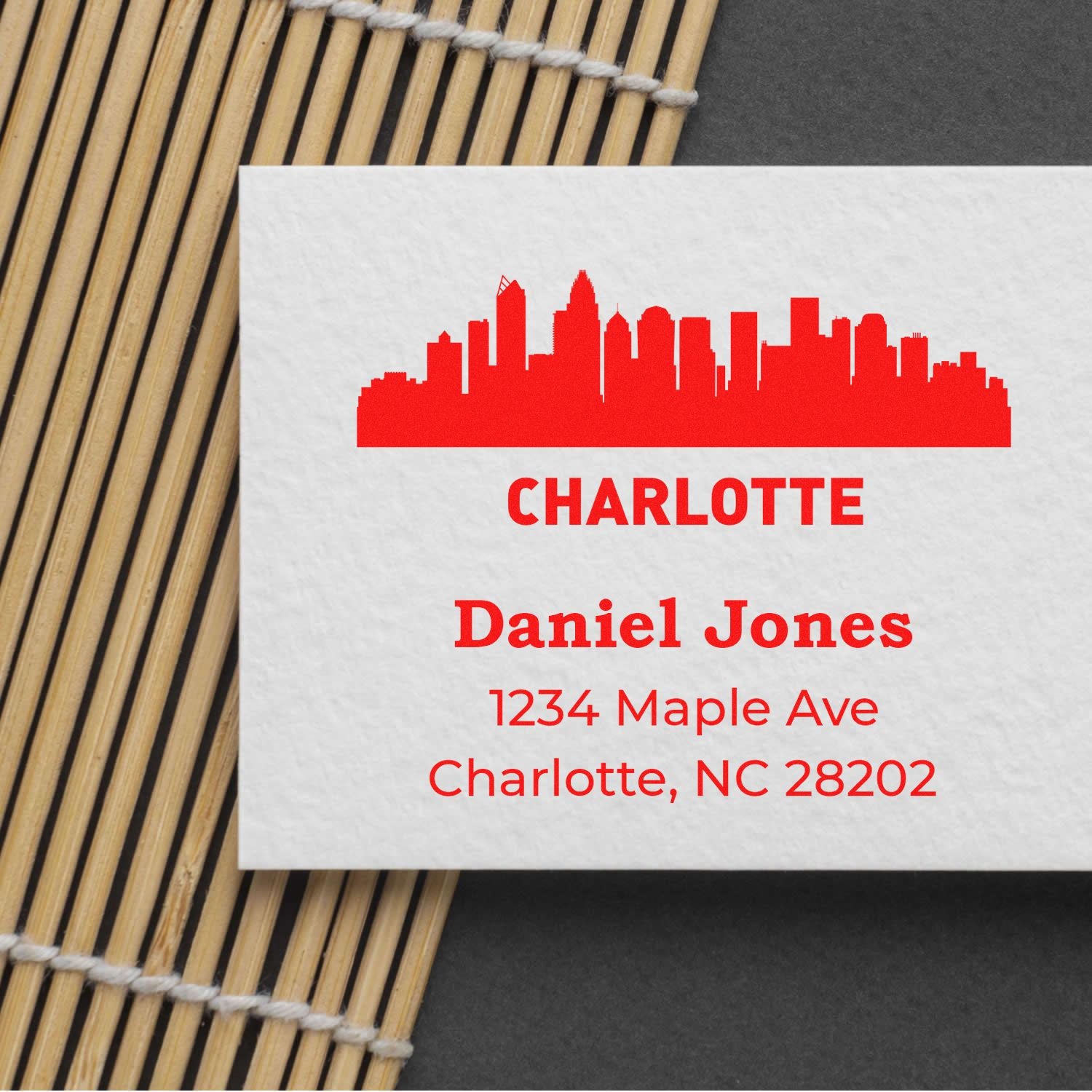 Custom Charlotte skyline return address rubber stamp for Daniel Jones, 1234 Maple Ave, Charlotte, NC 28202