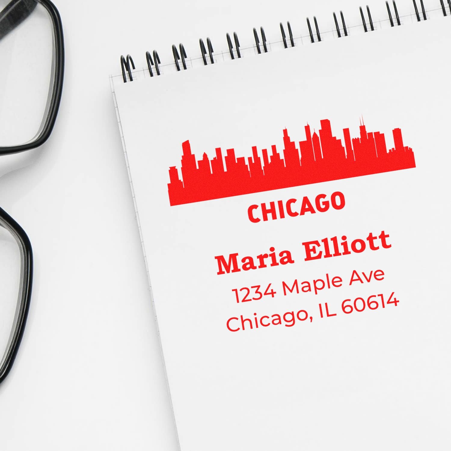 Custom Chicago address rubber stamp with skyline design, personalized for Maria Elliott, 1234 Maple Ave, Chicago, IL 60614.