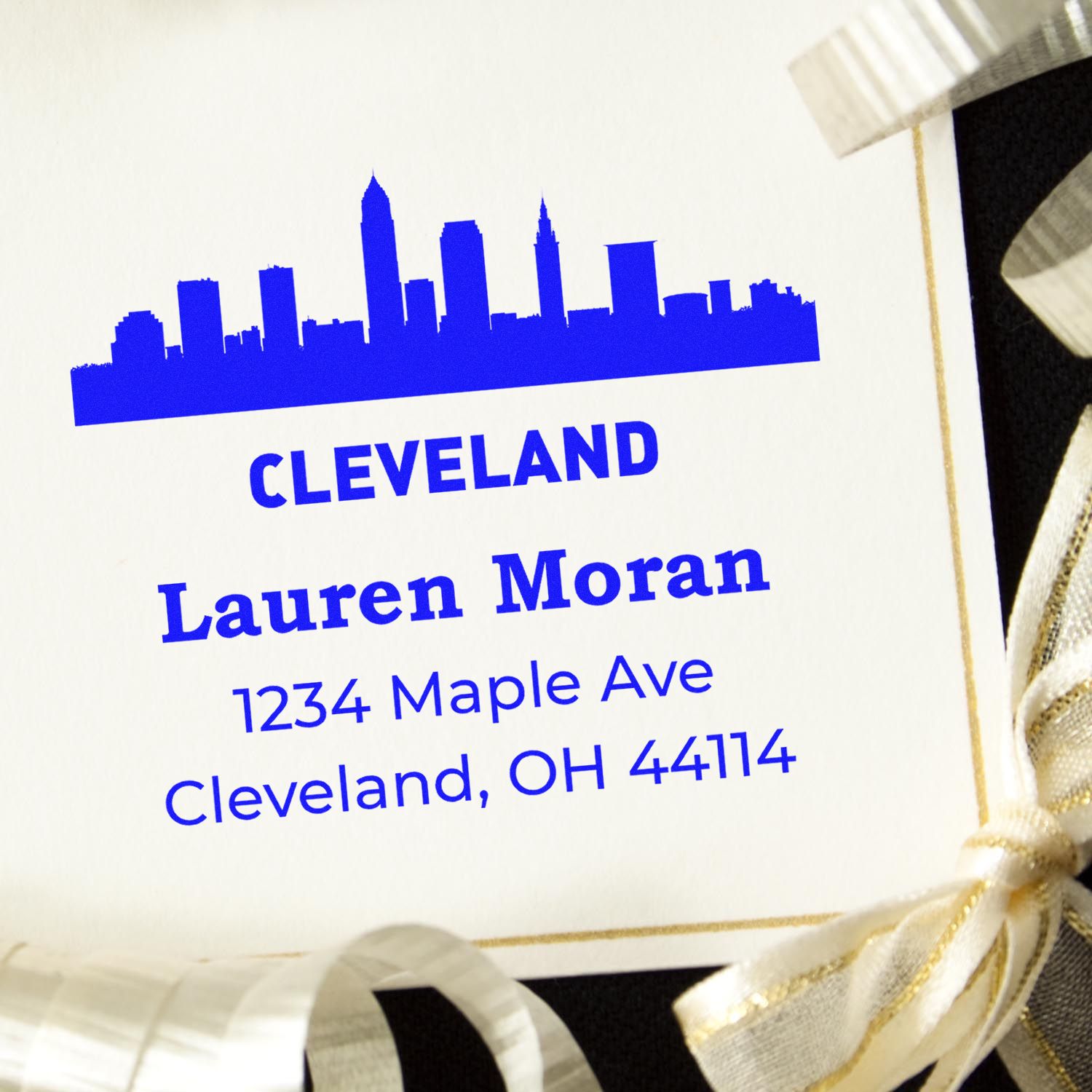 Custom Cleveland address rubber stamp with skyline logo, personalized for Lauren Moran return mailings.