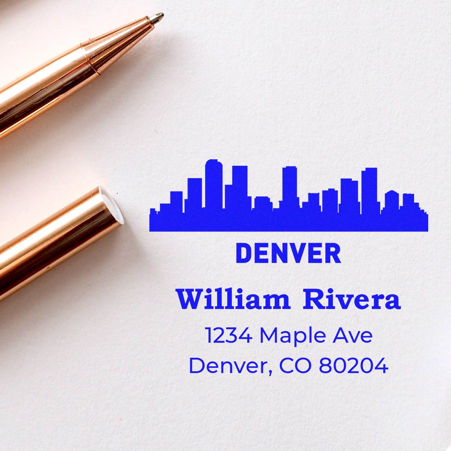 Custom Denver address rubber stamp with skyline logo, William Rivera, 1234 Maple Ave, Denver, CO 80204.