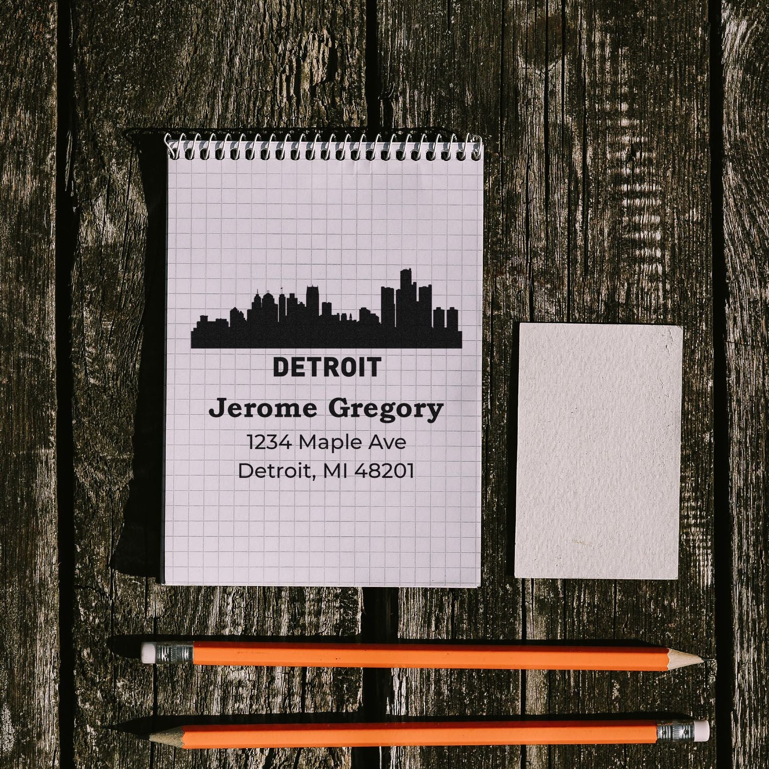 Custom address rubber stamp design with Detroit skyline, name, and mailing address for personalized return address stamps.