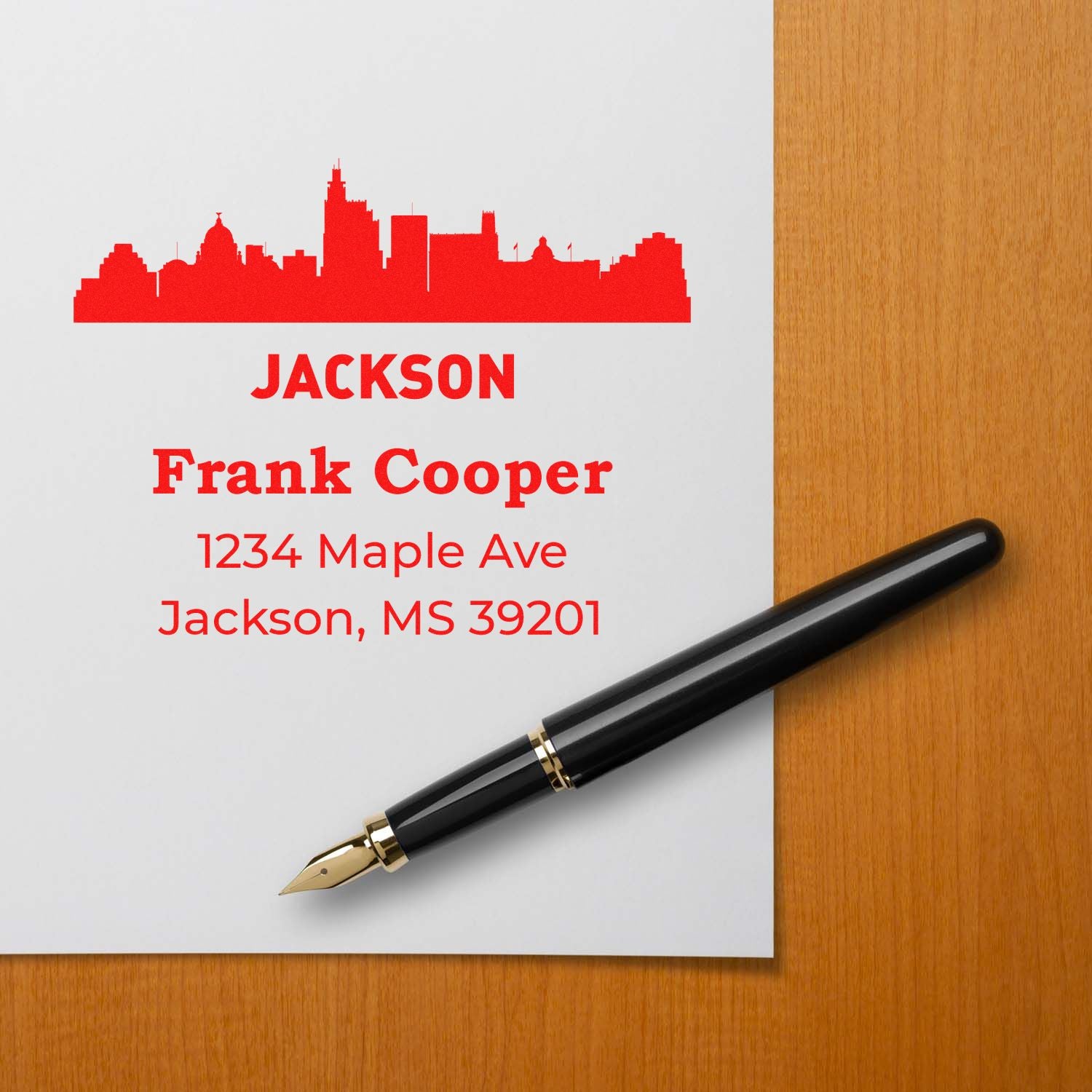 Custom Jackson, MS address rubber stamp with skyline design, Frank Cooper name, and 1234 Maple Ave return address.