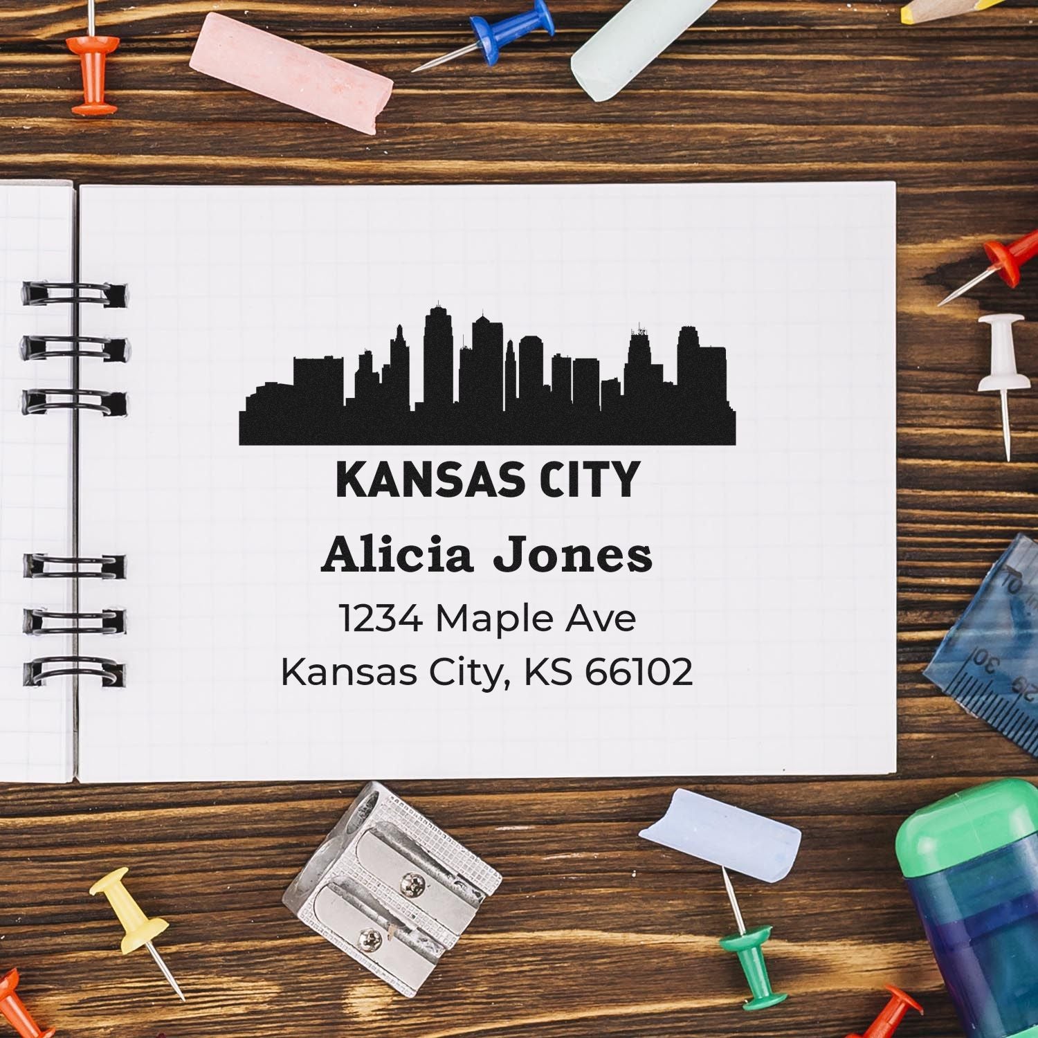 Personalized Kansas City rubber stamp with skyline logo, name, and return address for mailing.