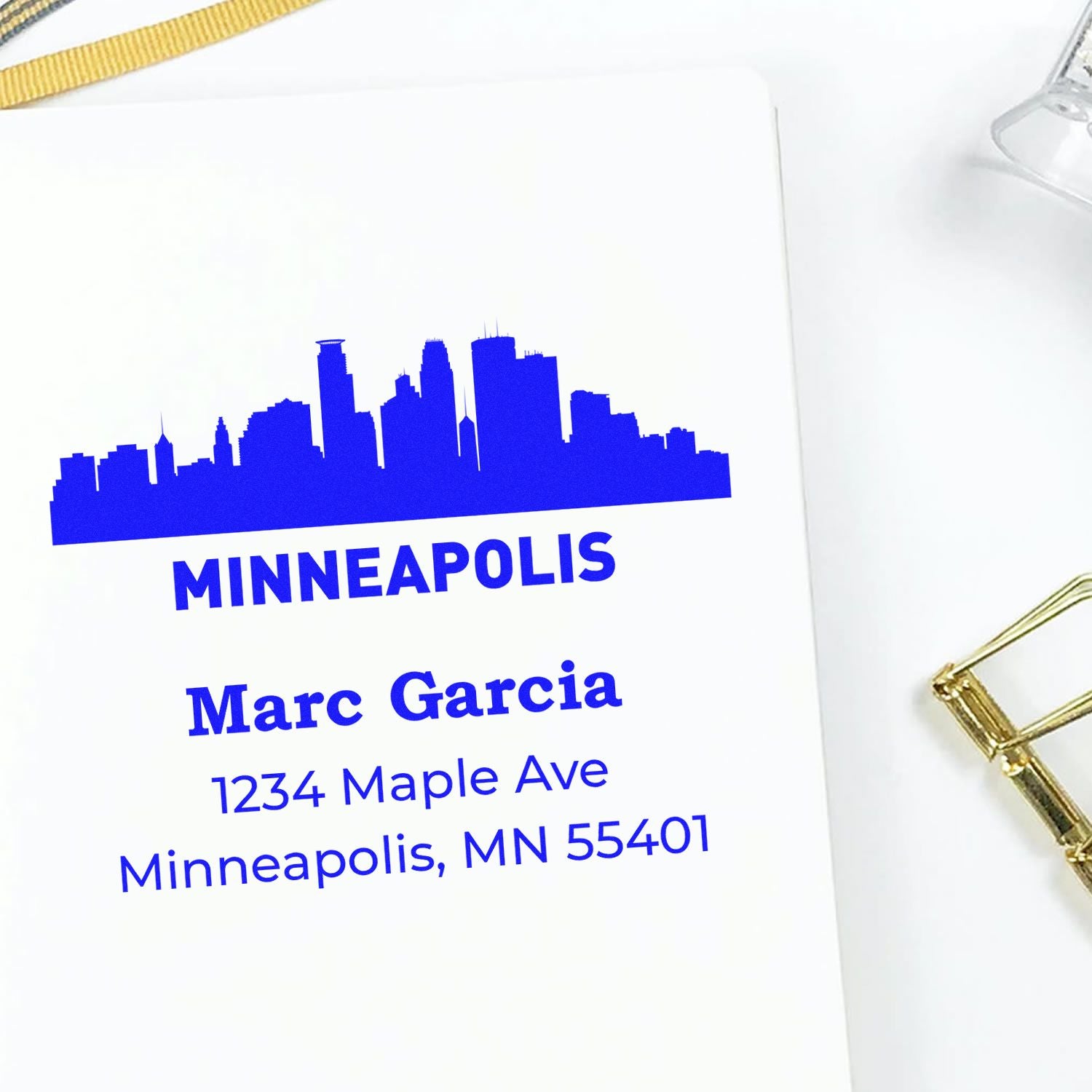 Custom Minneapolis return address rubber stamp with skyline, name, street address, and ZIP code for personal mail labeling.