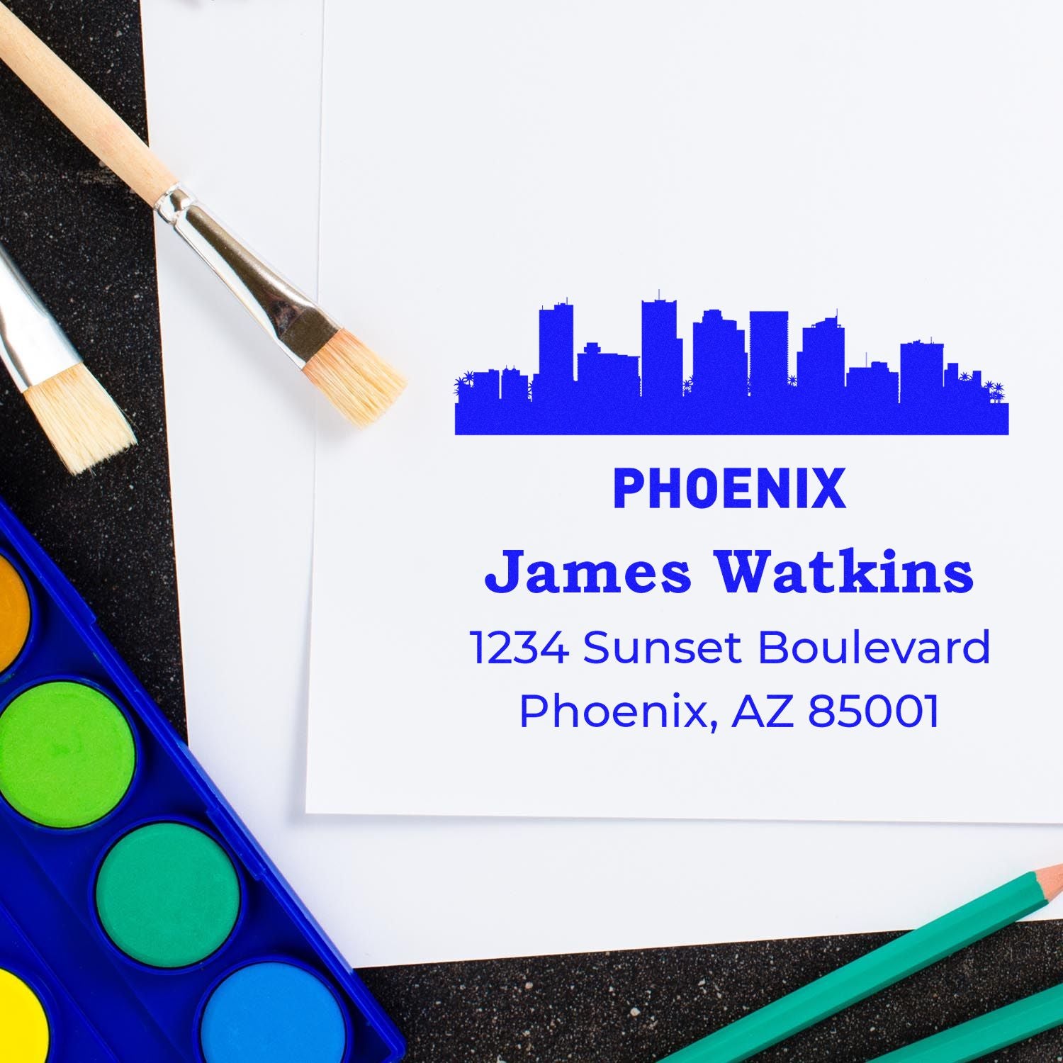 Custom Phoenix address rubber stamp mockup with skyline, name, and mailing address for stationery and craft projects.