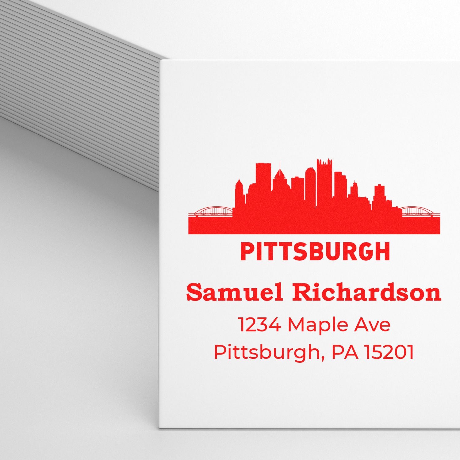 Custom Pittsburgh address rubber stamp with skyline design and recipient name, ideal for envelopes and stationery.