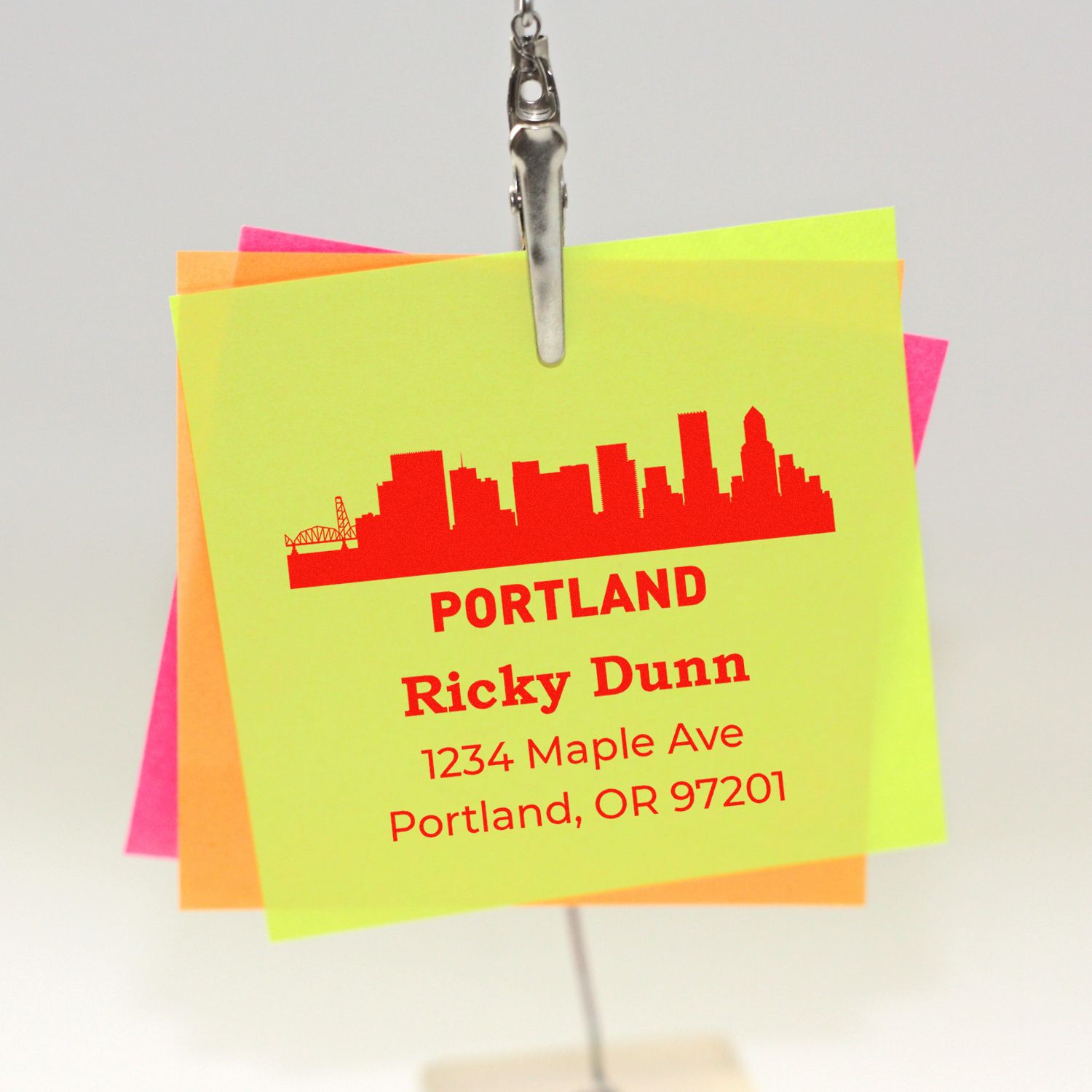 Personalized rubber stamp imprint on neon note cards with Portland skyline, name, street address, and ZIP code.