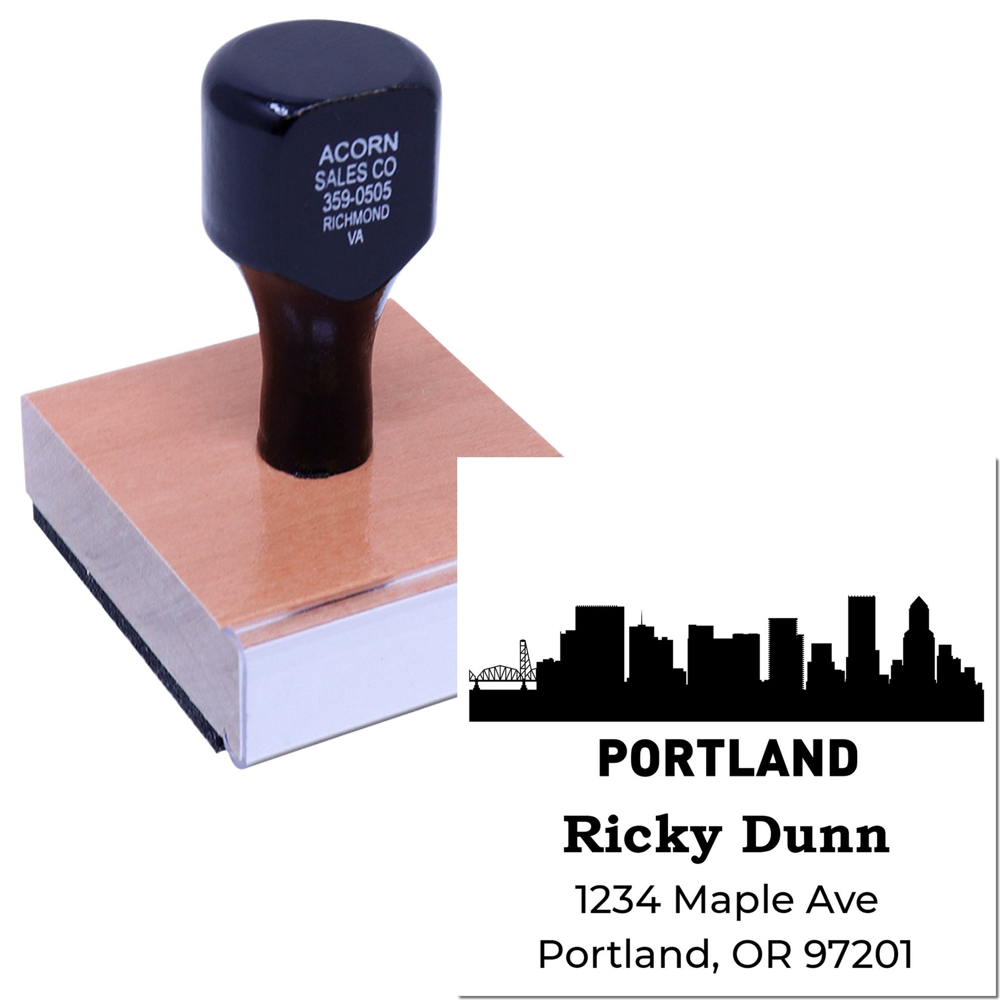 Custom Portland address rubber stamp with skyline logo and return address imprint for business mailings.
