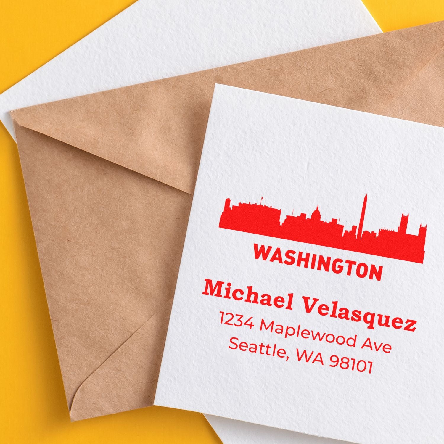 Custom rubber stamp return address on envelopes with Washington skyline design for personalized mail.