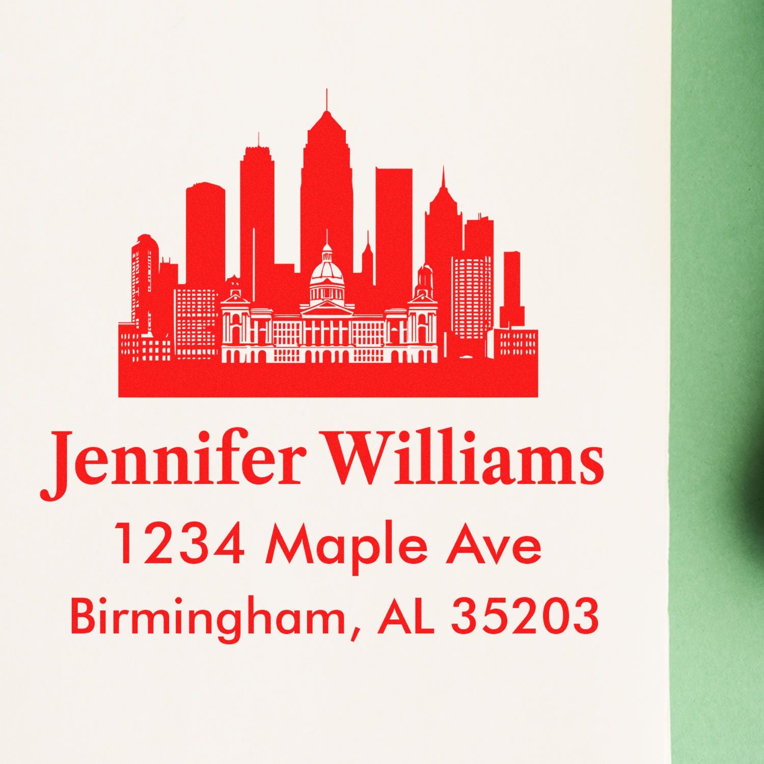 Custom rubber return address stamp with Birmingham skyline for Jennifer Williams, 1234 Maple Ave, Birmingham, AL 35203.