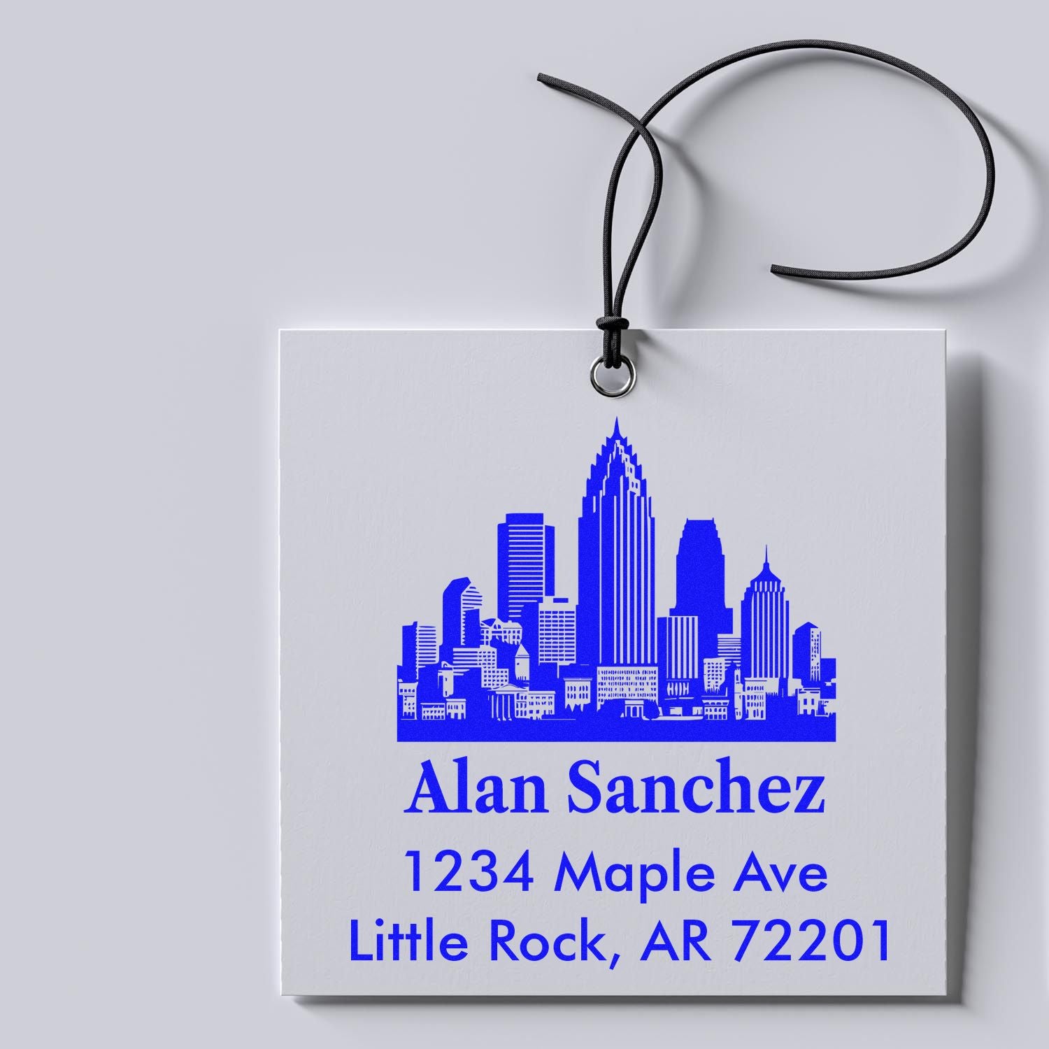 Personalized return address rubber stamp with skyline design for Alan Sanchez, 1234 Maple Ave, Little Rock, AR 72201.