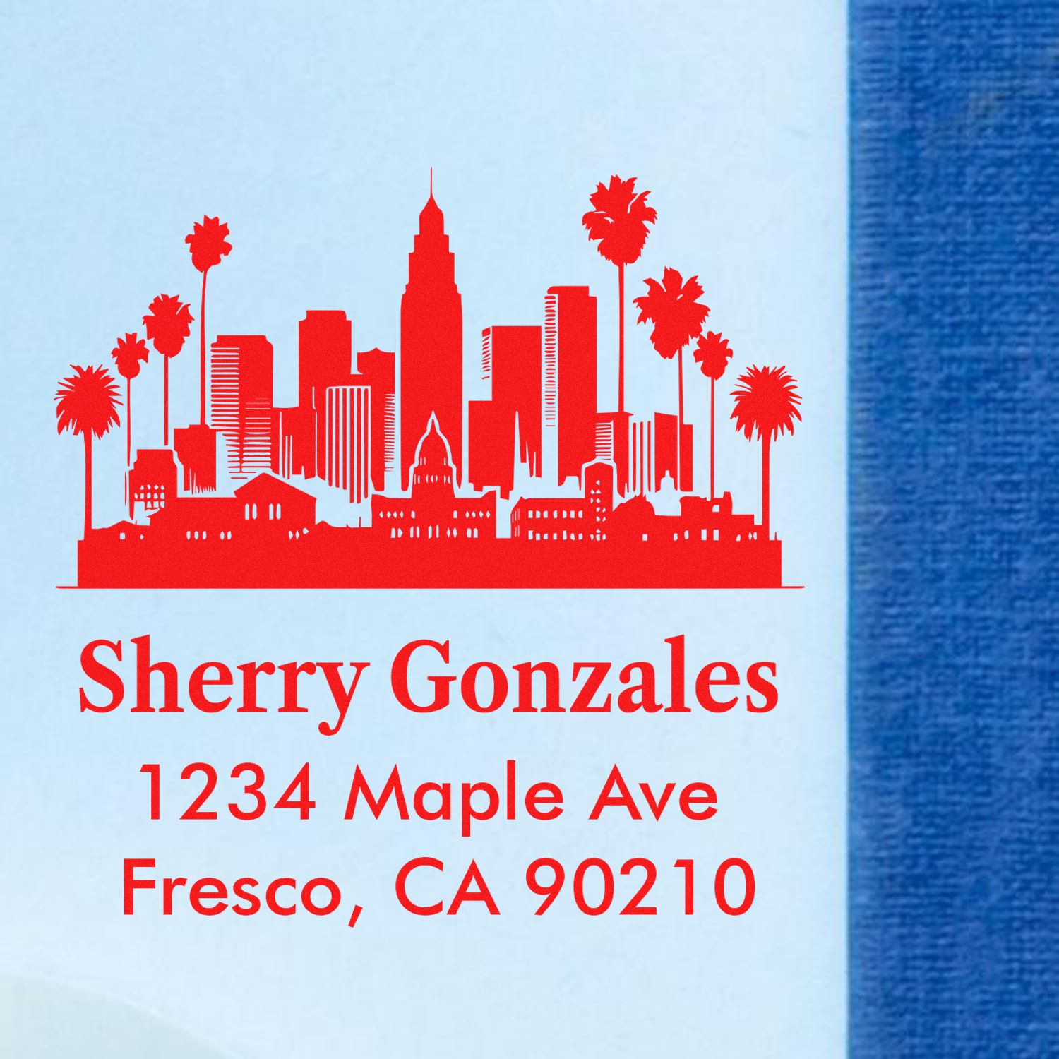 Custom rubber return address stamp with skyline and palm design for Sherry Gonzales, 1234 Maple Ave, Fresno, CA 90210