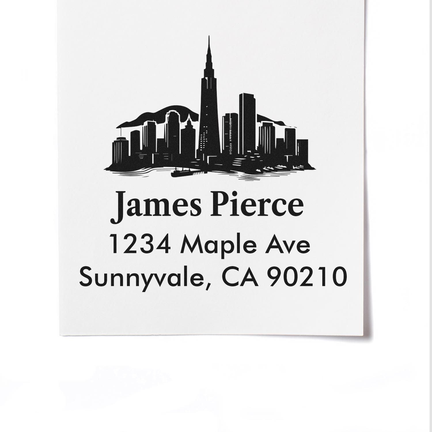 Custom return address rubber stamp with skyline design for James Pierce, 1234 Maple Ave, Sunnyvale, CA 90210