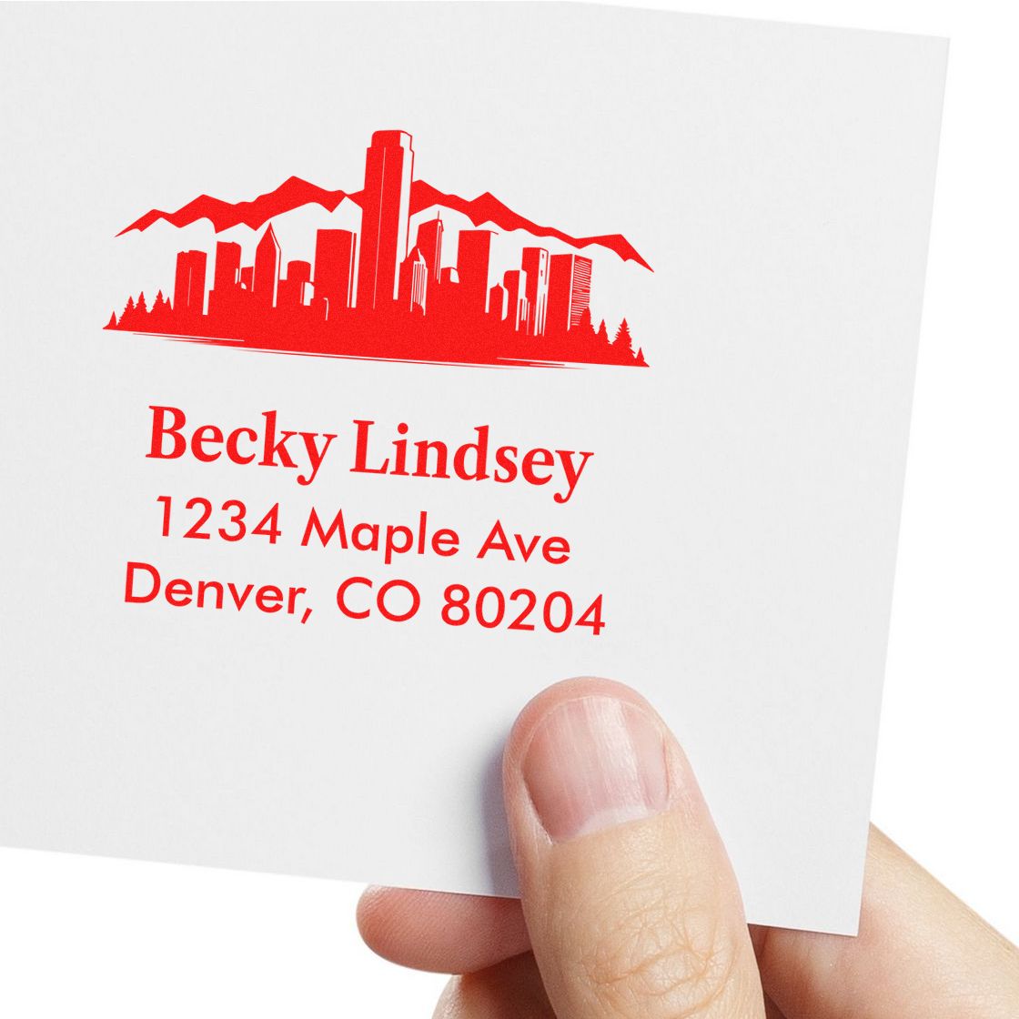 Custom return address rubber stamp with Denver skyline, featuring Becky Lindsey and 1234 Maple Ave, Denver, CO 80204.