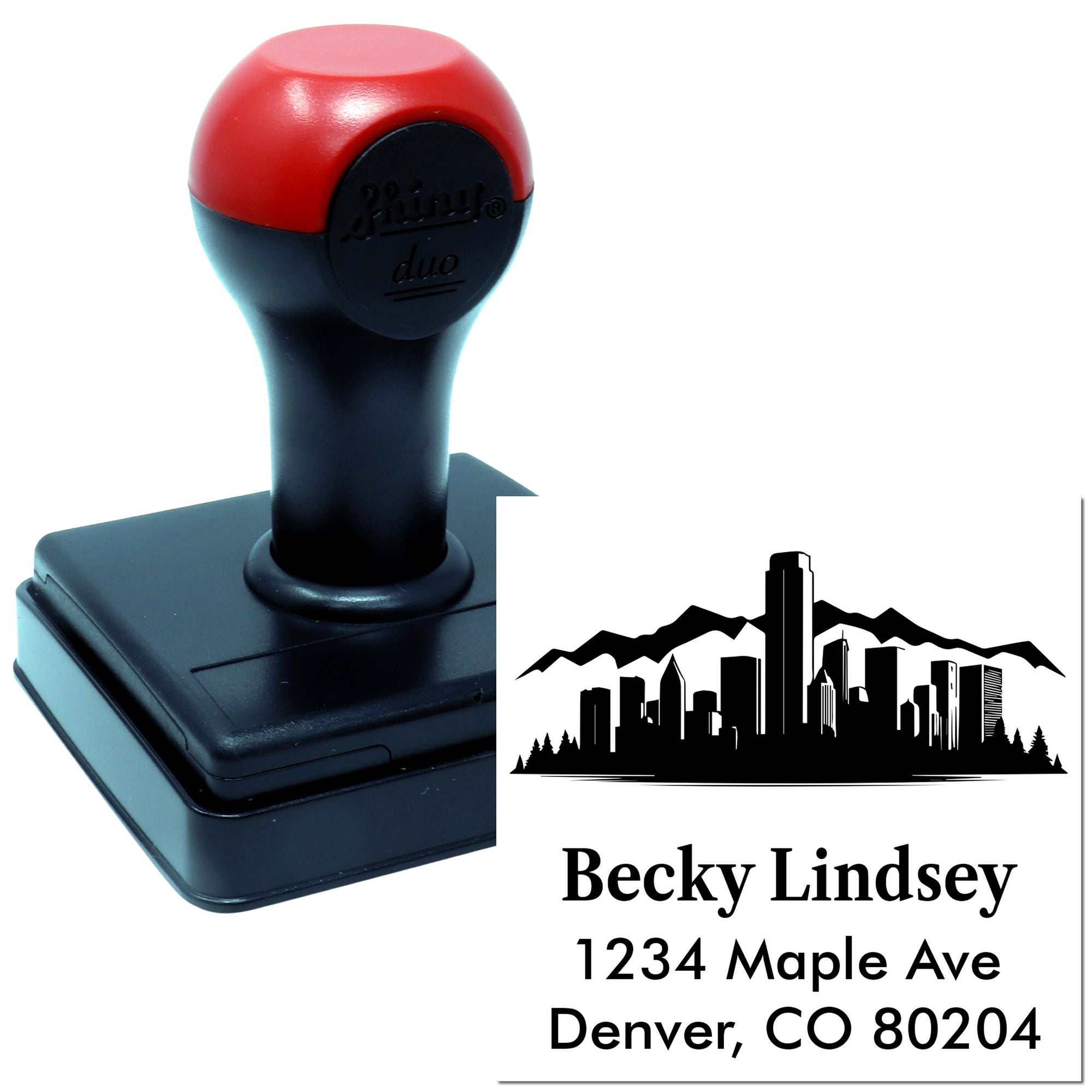Custom self-inking rubber stamp with skyline logo and Denver, CO return address for personalized mailing.