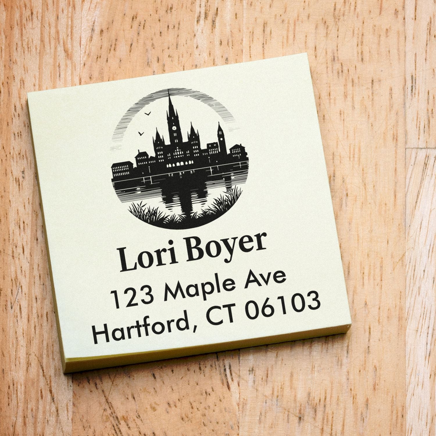 Custom address rubber stamp with Hartford skyline, Lori Boyer name, and 123 Maple Ave, Hartford, CT 06103.