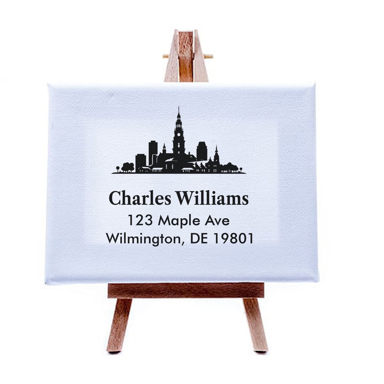 Custom address rubber stamp with city skyline for Charles Williams, Wilmington, DE 19801 personalized mailing.