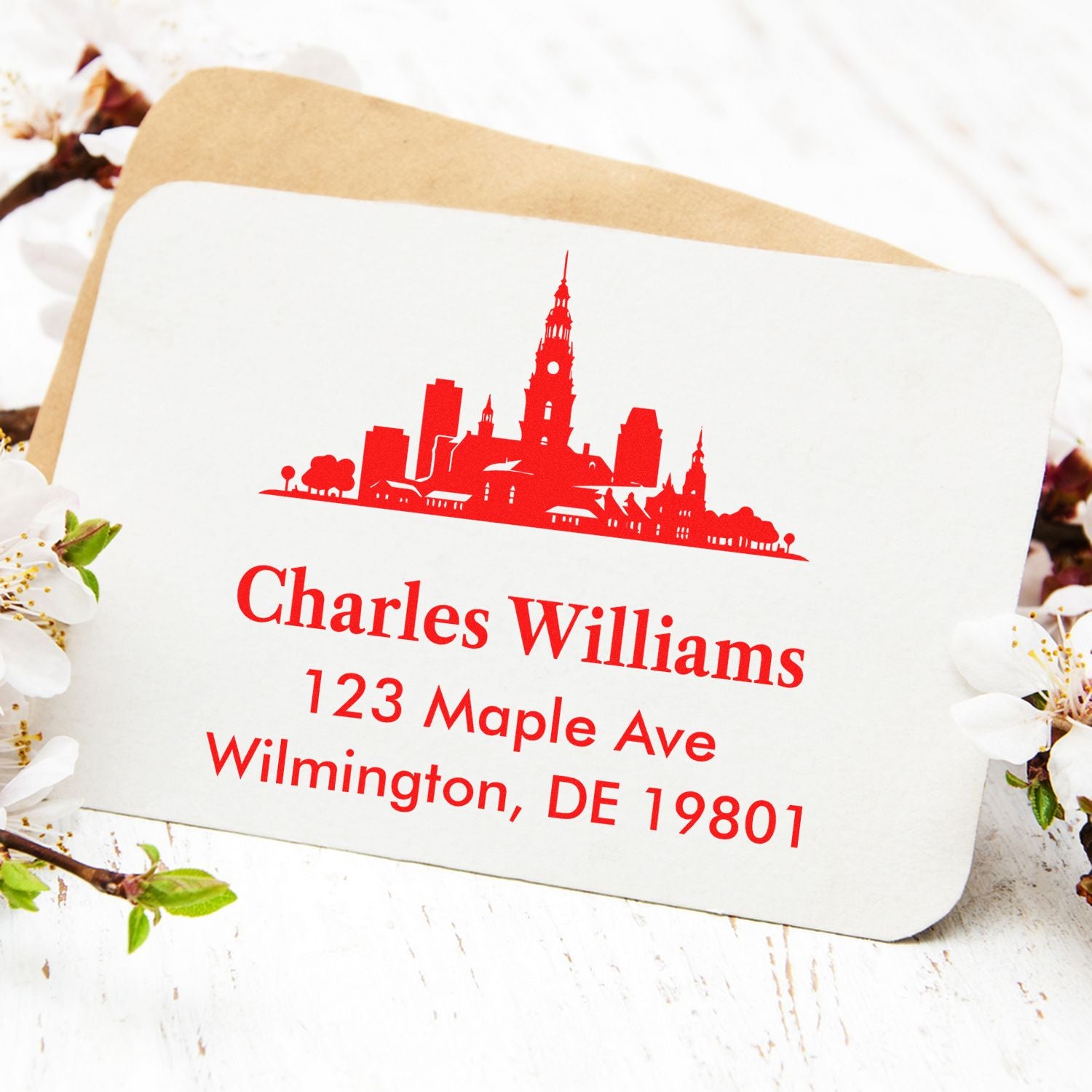 Personalized return address rubber stamp with skyline design for Charles Williams, Wilmington, DE 19801.