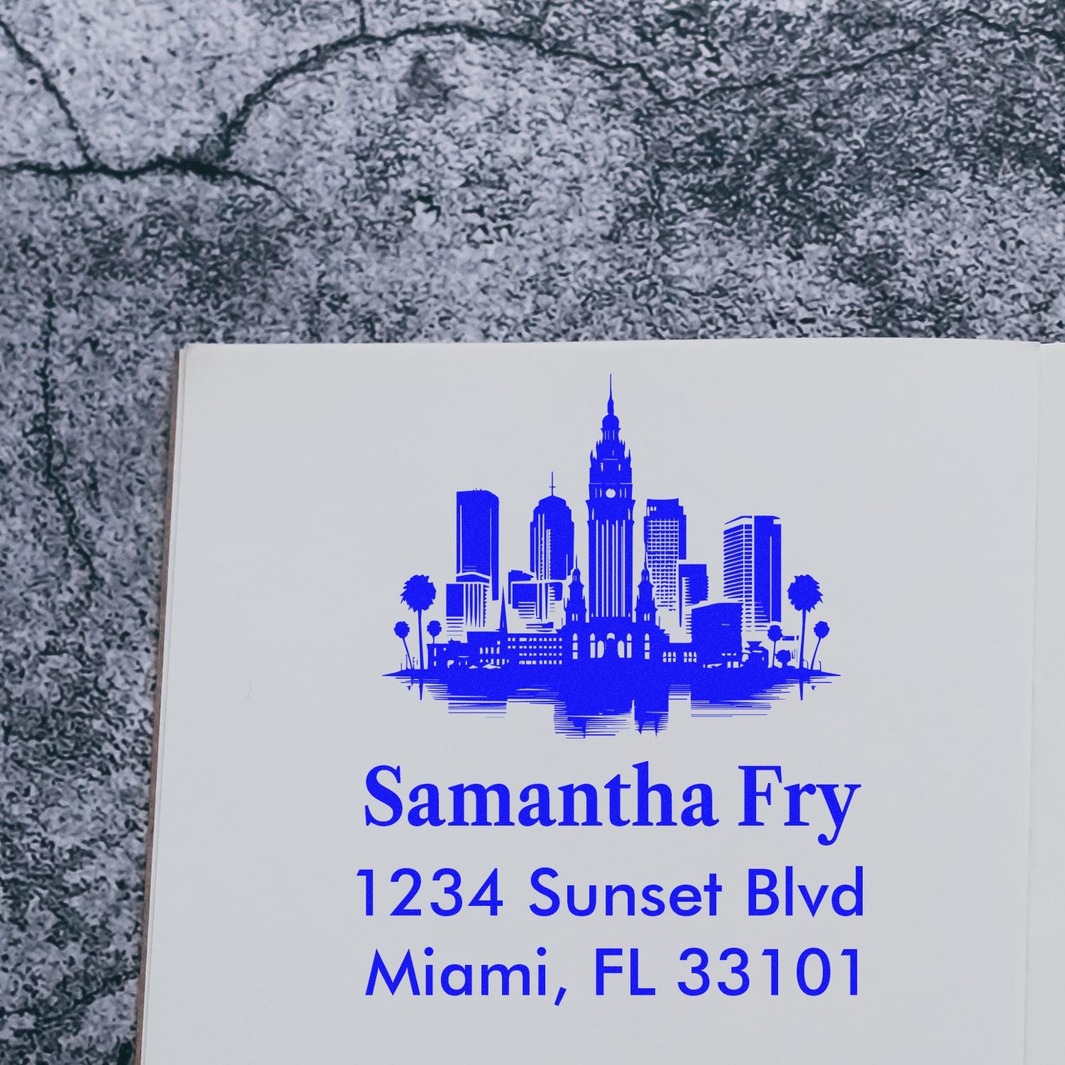 Personalized address rubber stamp with Miami skyline and return address for Samantha Fry, 1234 Sunset Blvd, Miami, FL 33101.