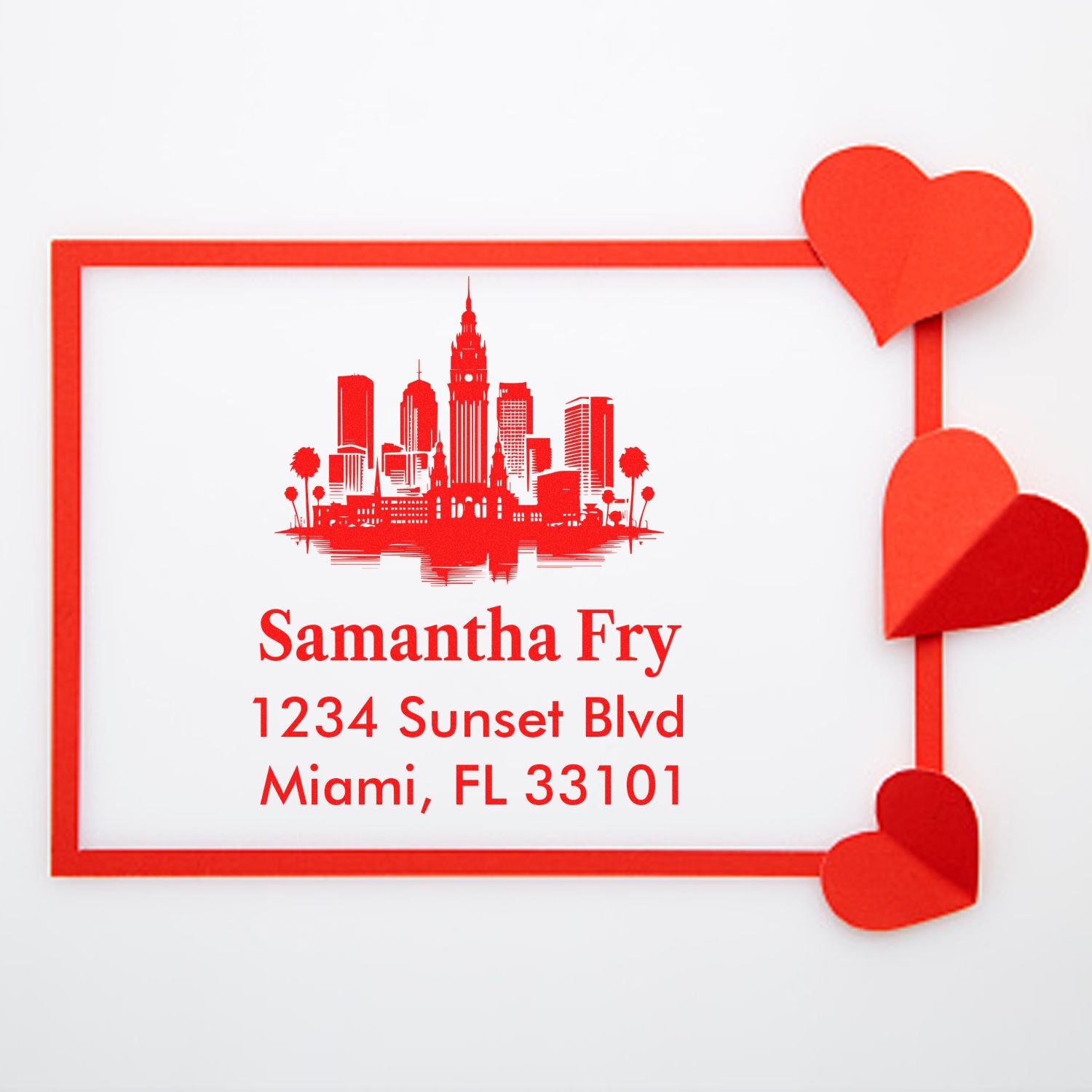 Custom rubber return address stamp with skyline and hearts for Samantha Fry, Miami, FL 33101.