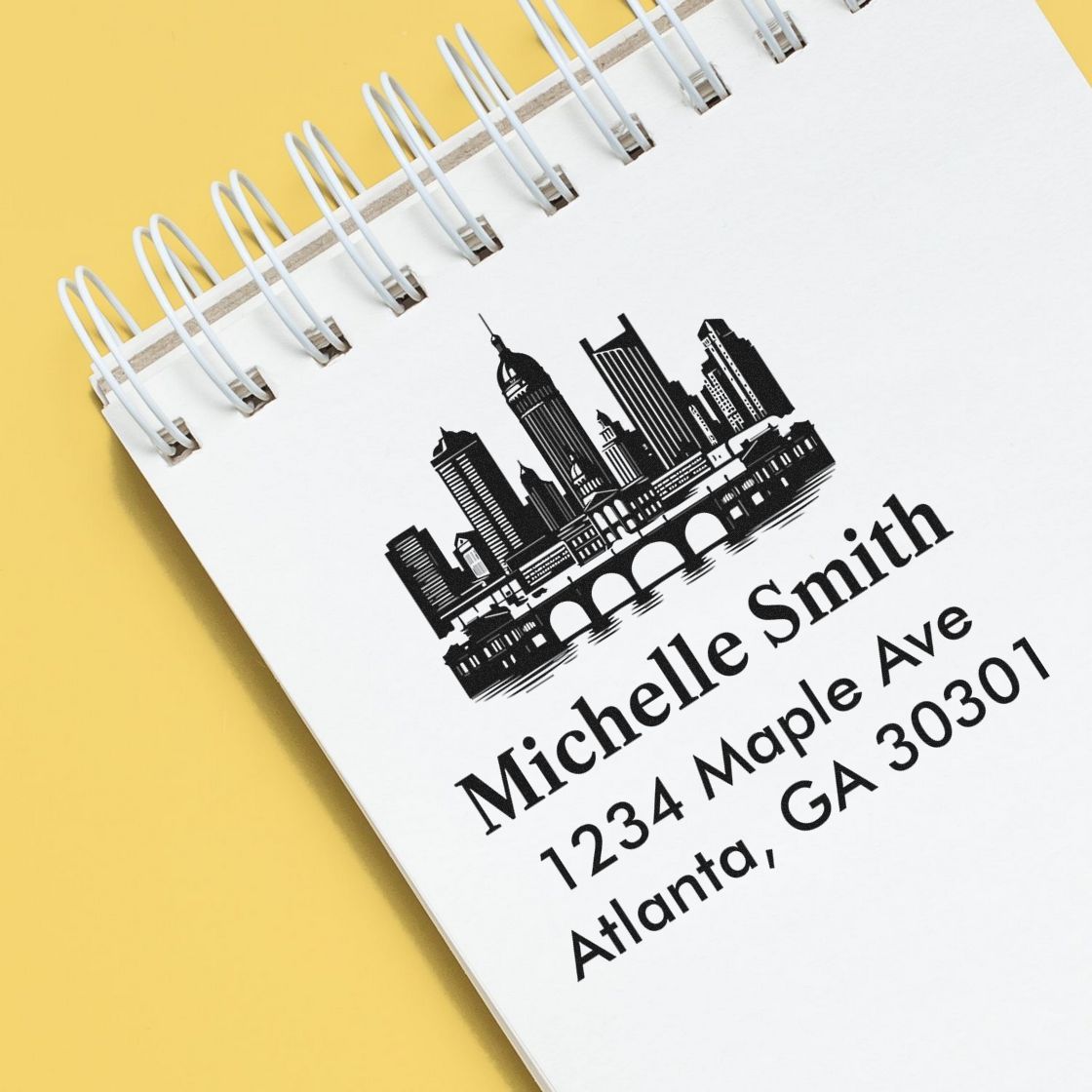 Custom return address rubber stamp with Atlanta skyline design and personalized name and address for stationery.