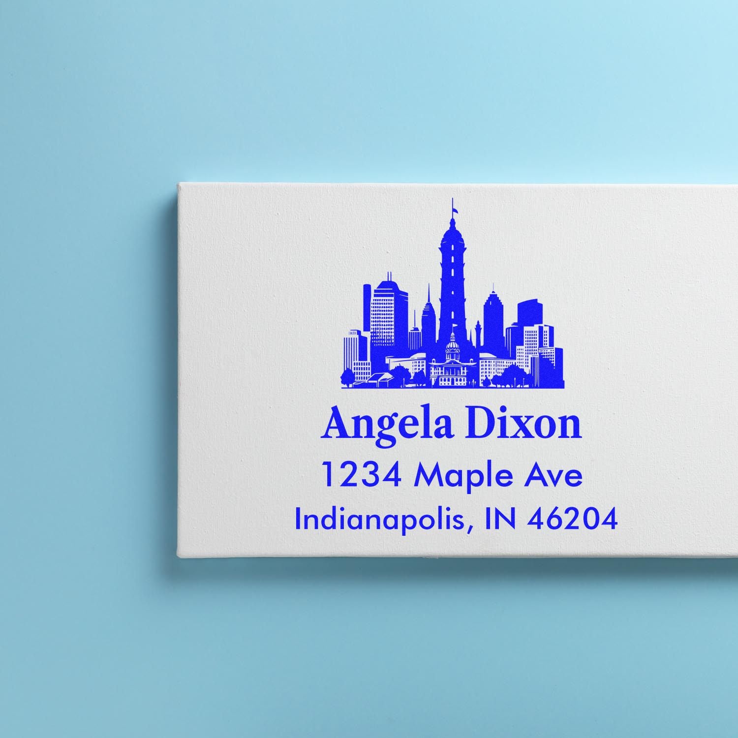 Personalized return address rubber stamp with Indianapolis skyline, Angela Dixon, 1234 Maple Ave, Indianapolis, IN 46204.
