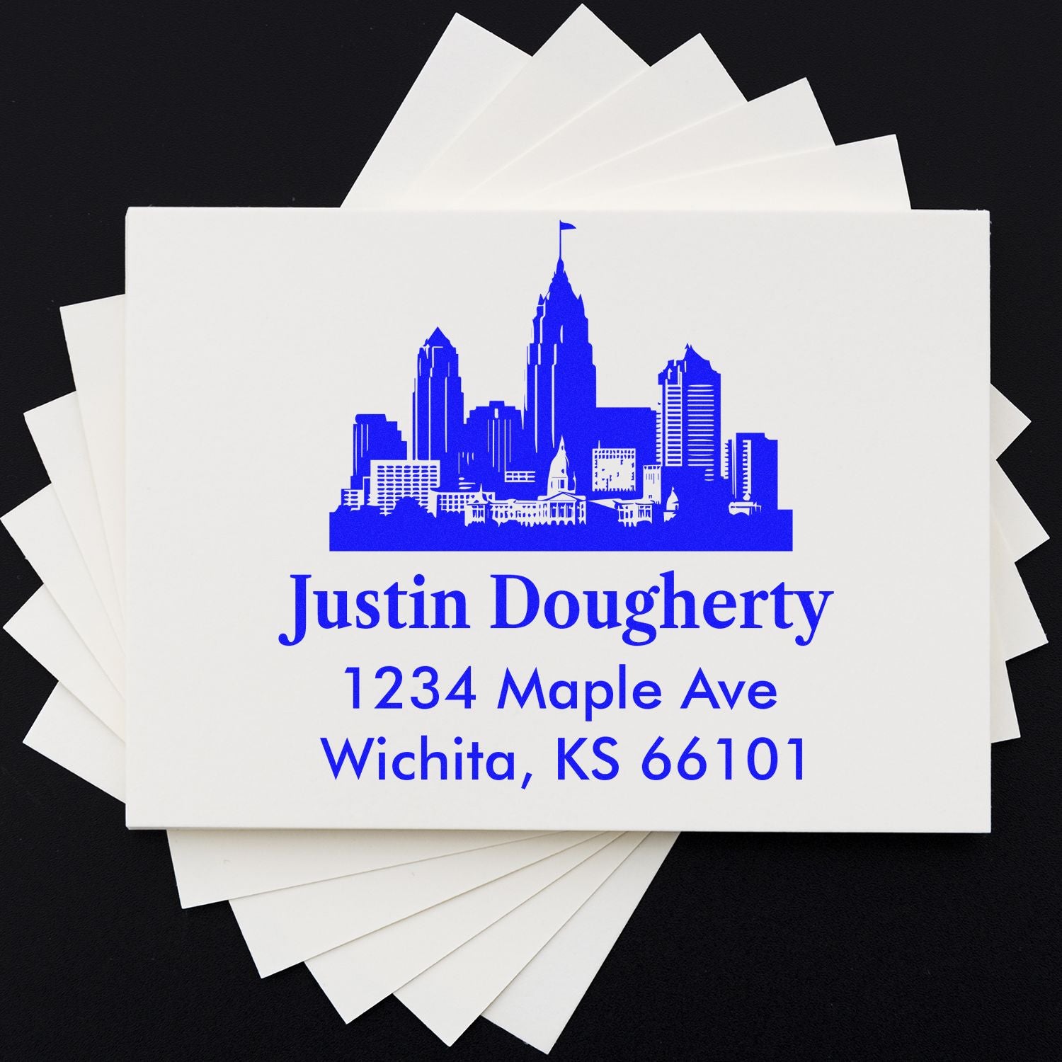 Personalized address rubber stamp with skyline logo for Justin Dougherty, Wichita, KS 66101