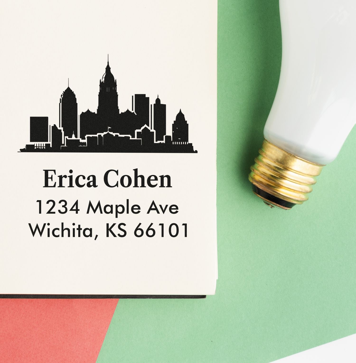 Custom rubber address stamp with Wichita skyline, Erica Cohen name, and mailing address.