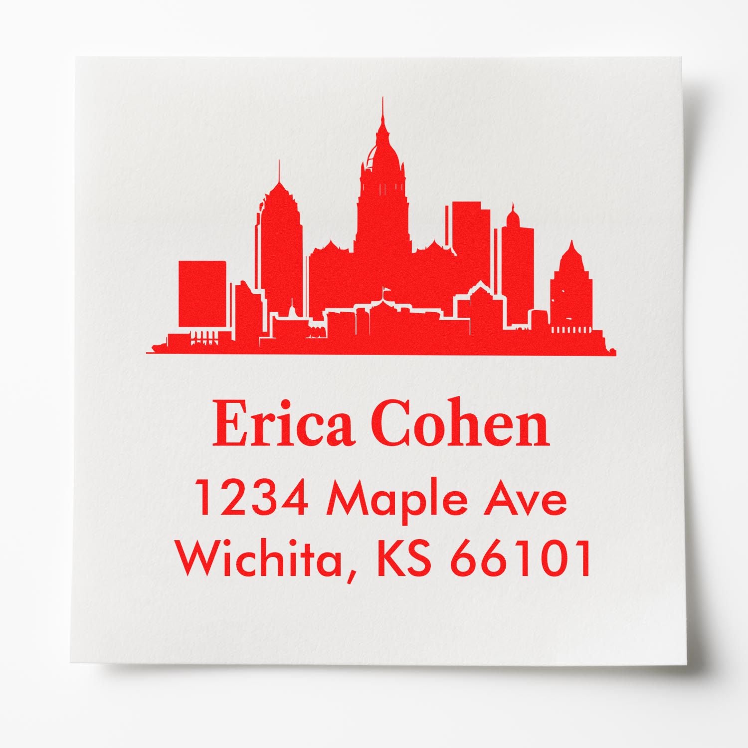 Custom return address rubber stamp with Wichita skyline for Erica Cohen, 1234 Maple Ave, Wichita, KS 66101.